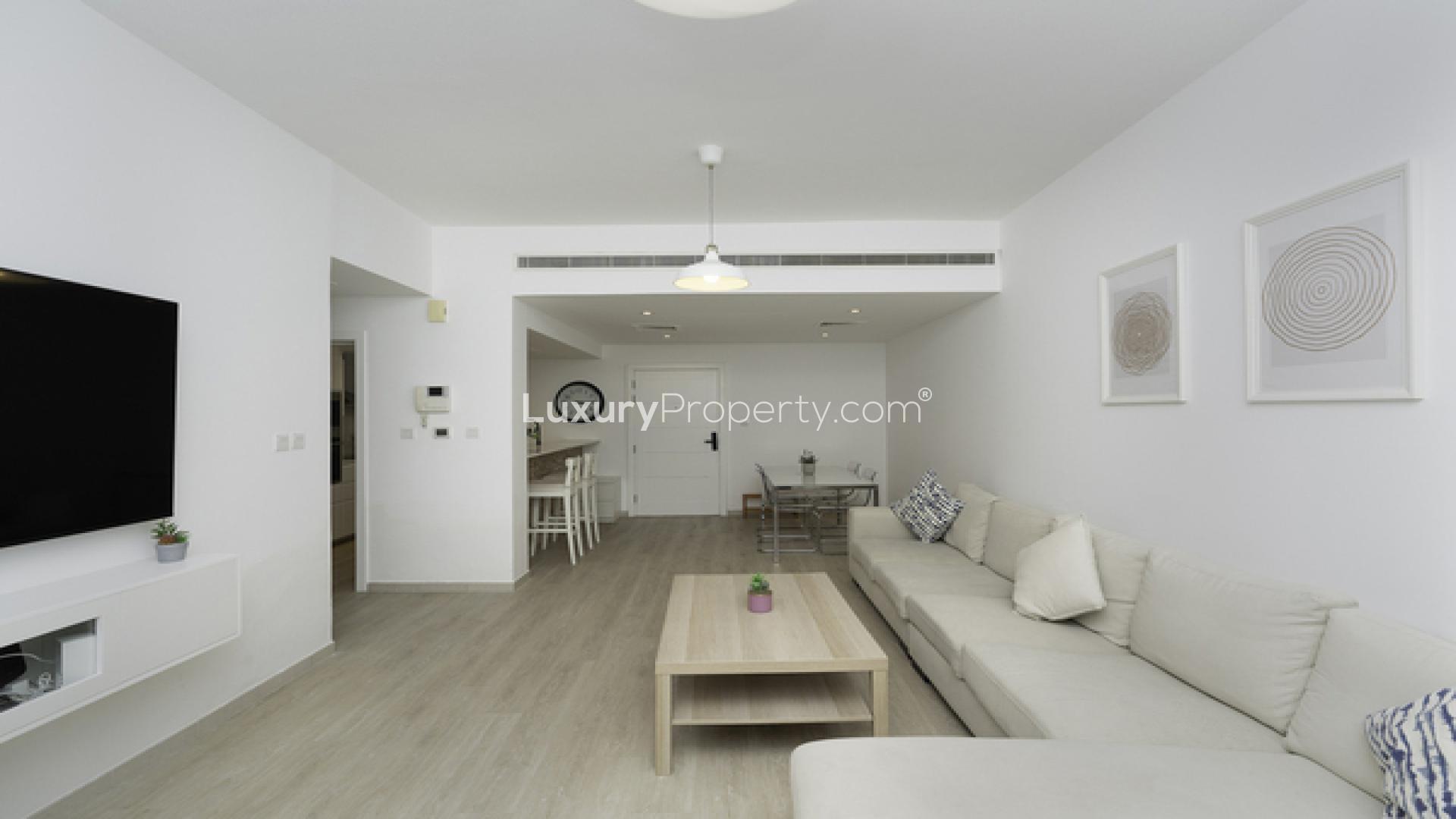 Modern living room in fully upgraded 1-bedroom apartment, Al Thayyal 4, The Greens