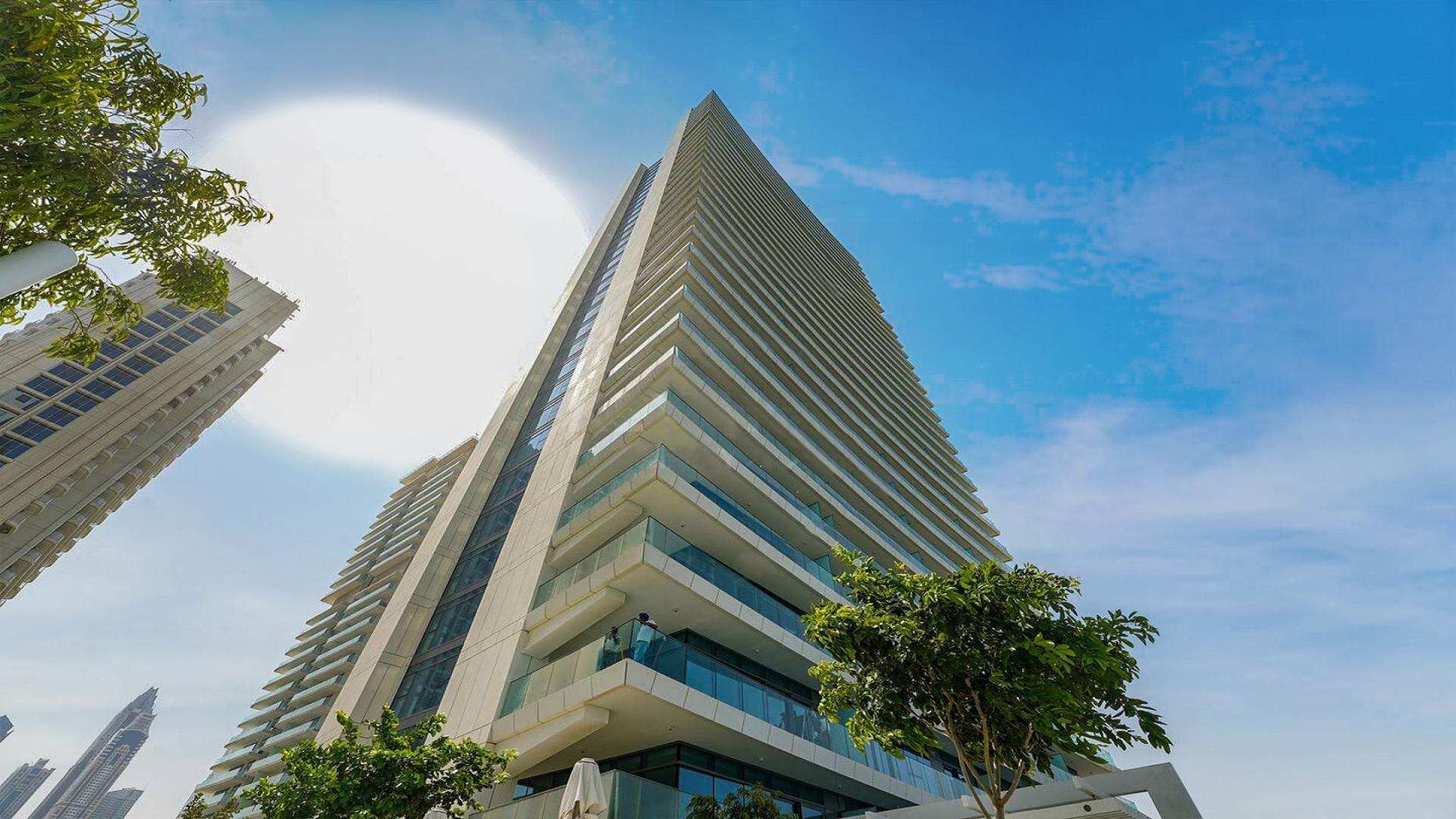 Balcony view from furnished apartment in Emaar Beachfront, Dubai Harbour, overlooking skyscrapers and sea