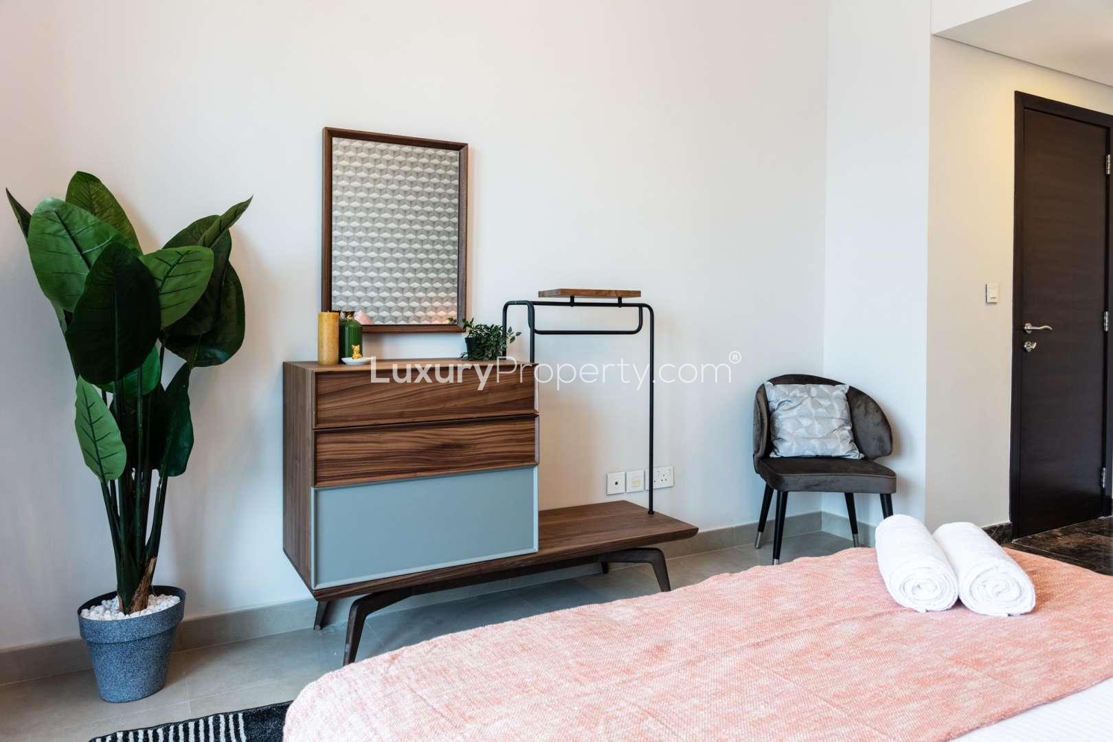 Elegant bedroom in 1-bedroom apartment, Sparkle Towers, Dubai Marina, featuring modern decor