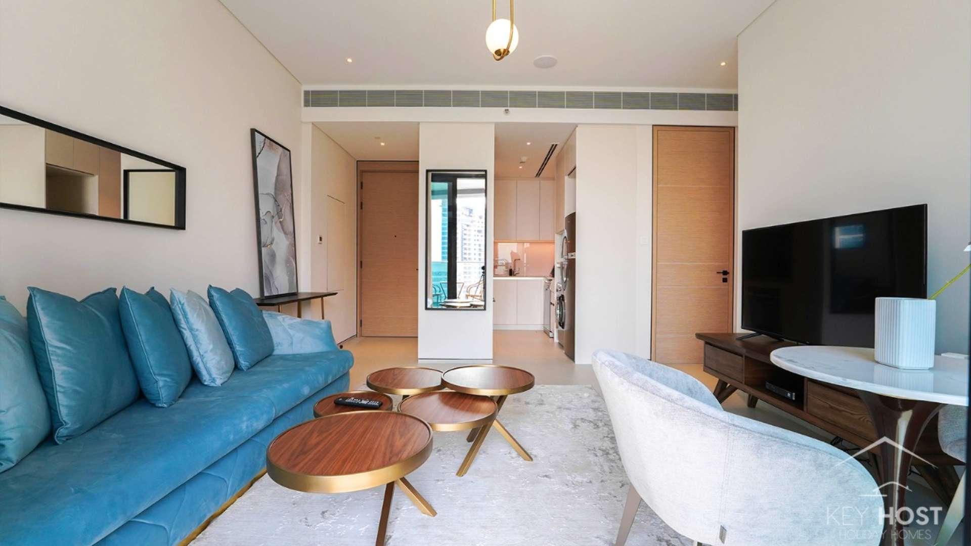 Contemporary one-bedroom apartment living room in The Address Jumeirah, with stylish furniture