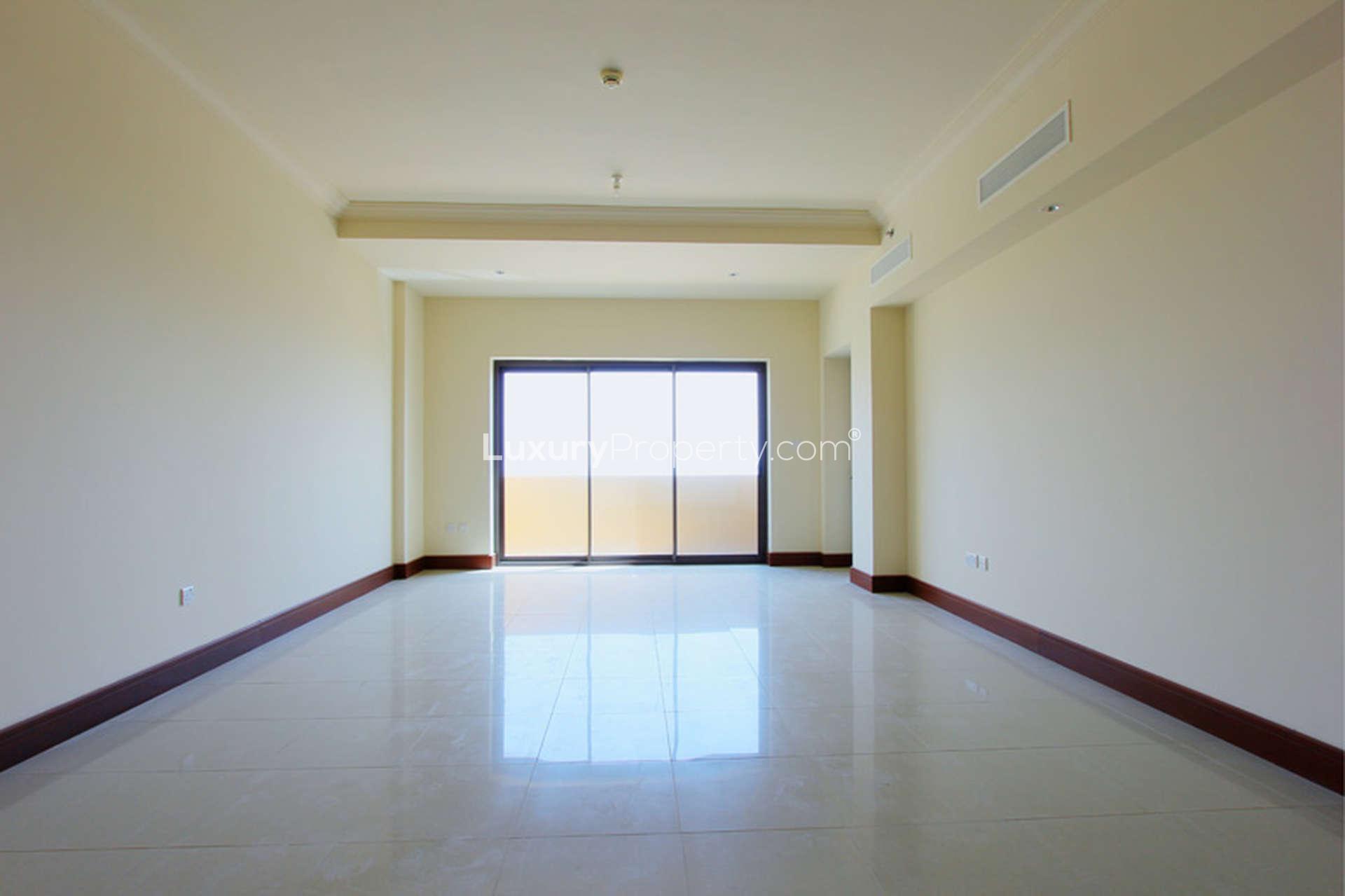 "Spacious balcony view from 1-bed apartment in Golden Mile 8, Palm Jumeirah for rent.",Spacious living room in 1-bed apartment, Golden Mile 8, Palm Jumeirah for rent