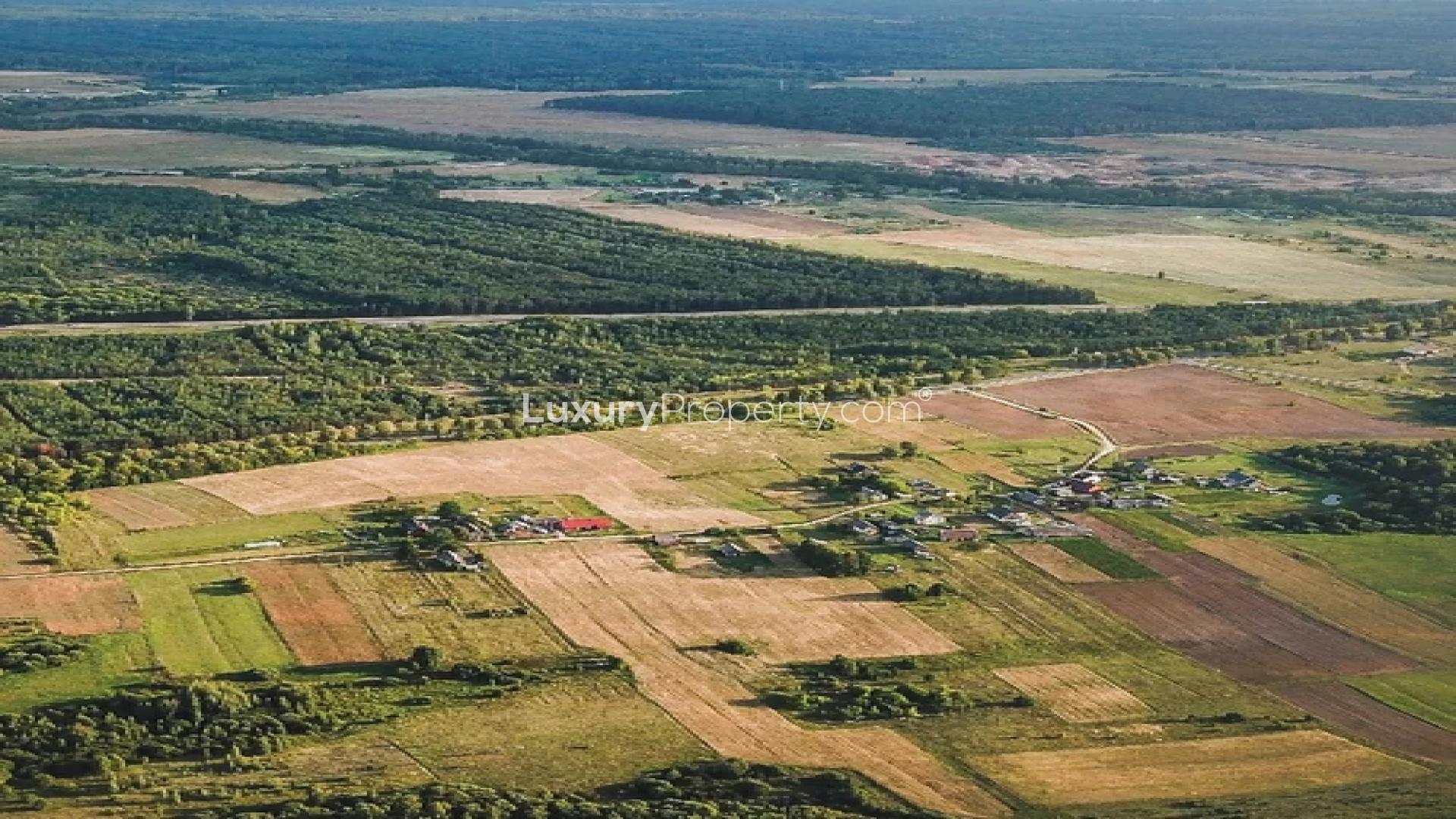 Aerial view of SOBHA Mountain Mist land development in Vedapatti, Coimbatore at sunset