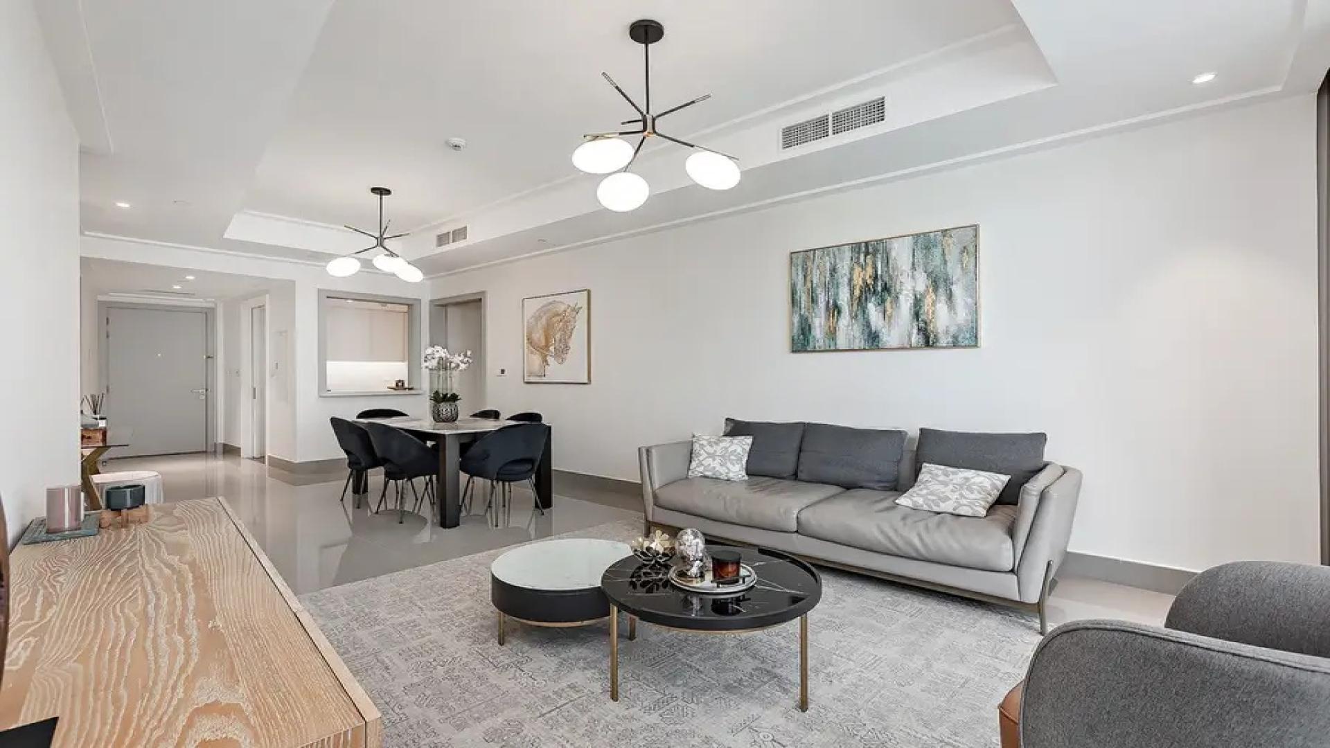 Modern penthouse living room in Opera Grand, Downtown, featuring chic decor and city views