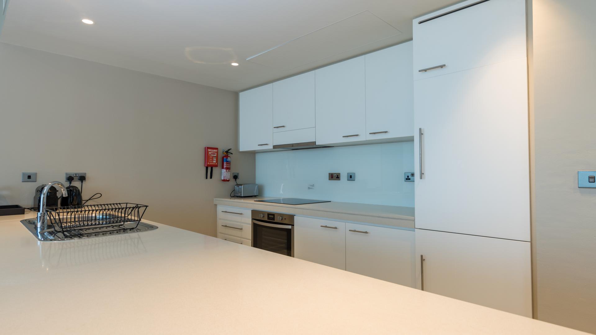 Modern kitchen in stylish one-bedroom apartment, Intercontinental Residence Suites, Dubai Festival City