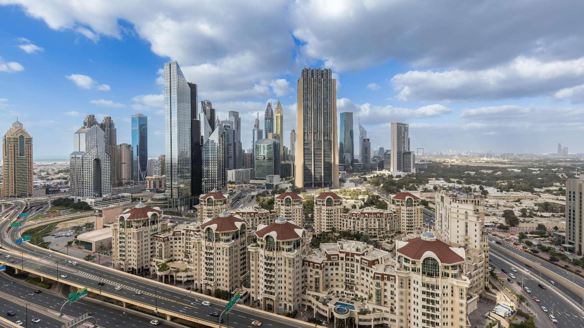 Luxury Downtown Dubai apartment bedroom with DIFC view, modern decor, and natural light