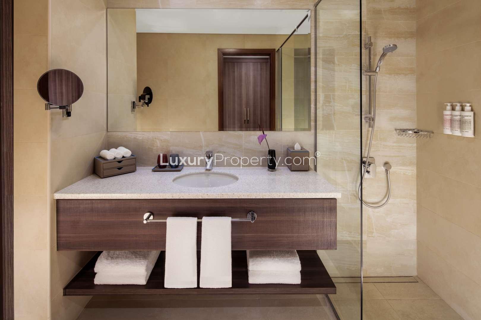 Modern kitchen in Palm View serviced apartment, Dubai Media City, featuring sleek appliances