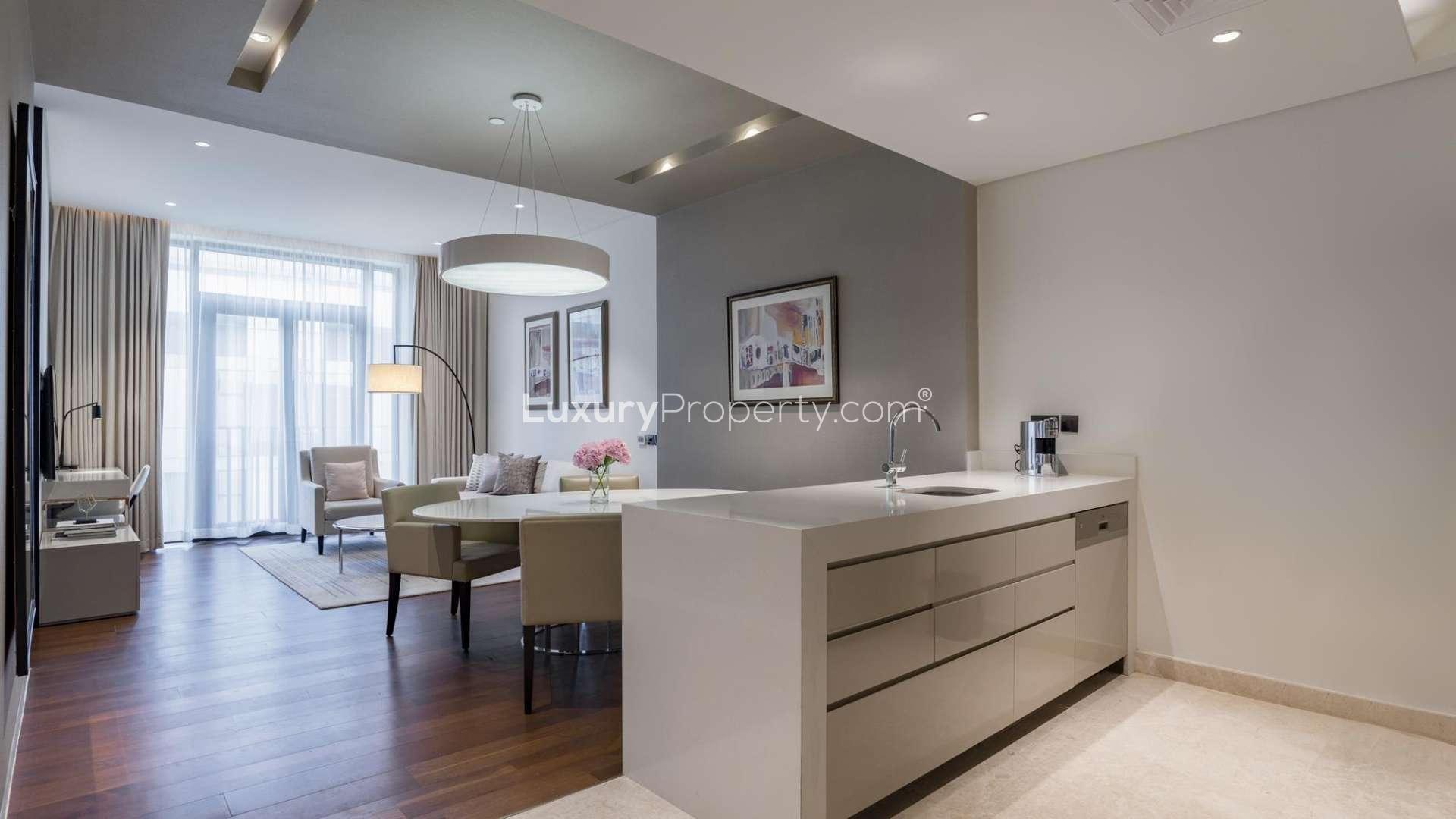 Rooftop infinity pool with stunning city skyline view at City Walk apartment