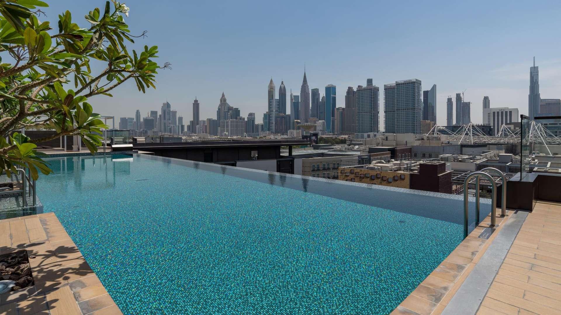 Contemporary living area in serviced apartment at City Walk, featuring modern furniture and decor