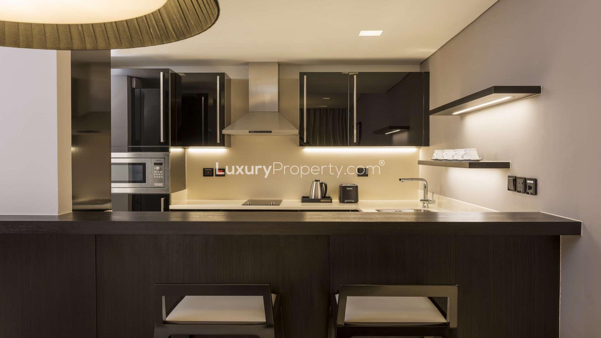 Modern kitchen in one-bed apartment at Sheraton Grand Hotel, Sheikh Zayed Road