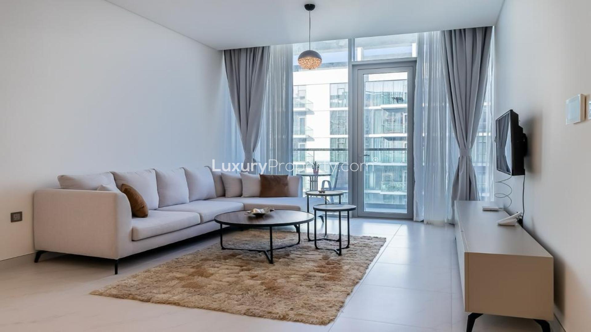 Turn-key 1-bedroom apartment living room with modern decor, lagoon view in MBR City