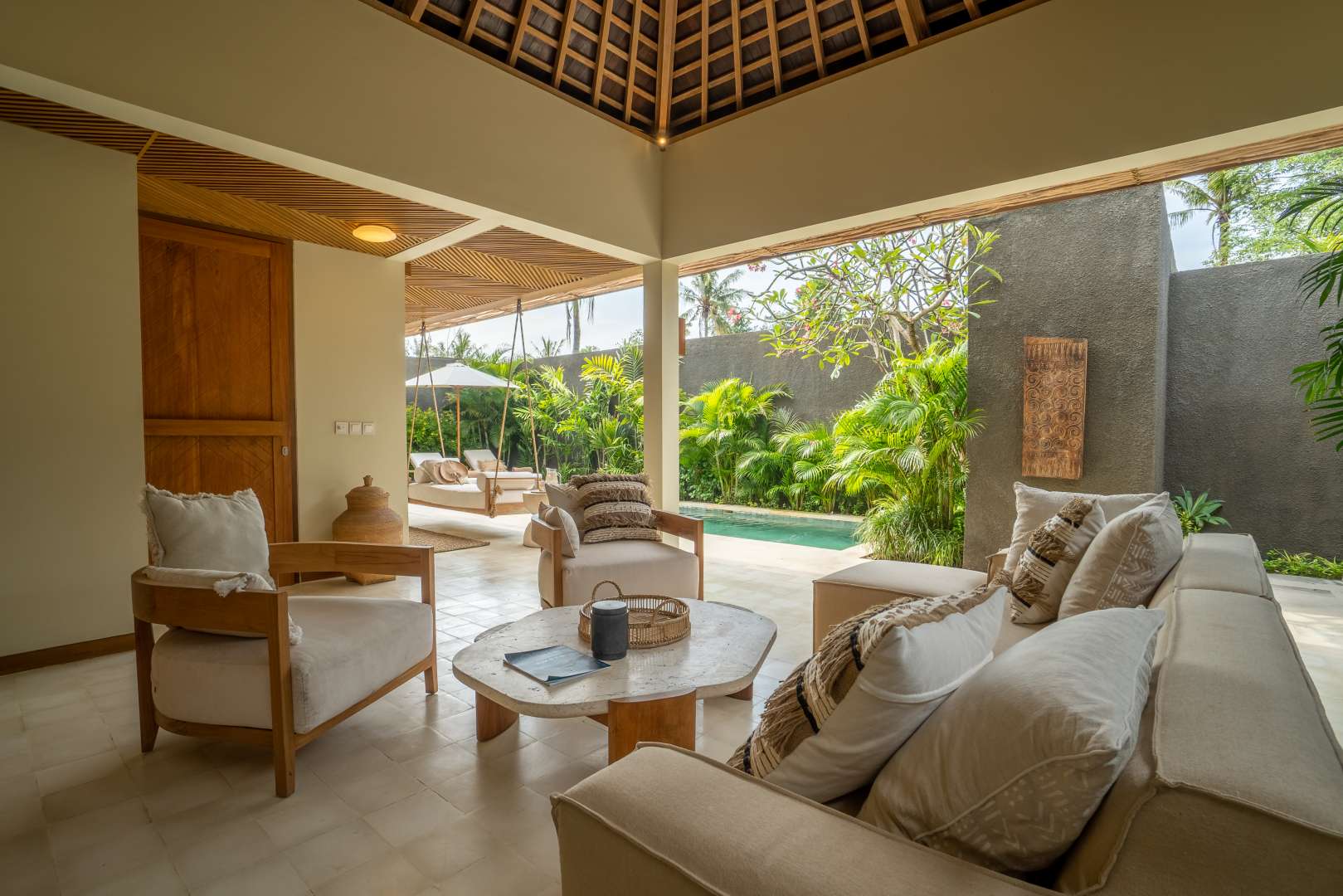 Luxurious bedroom in one-bedroom villa at Cocana Resort, Lombok with elegant canopy bed