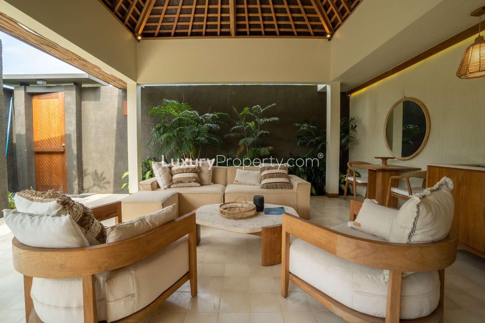 Luxurious villa living room with pool view at Cocana Resort, Lombok