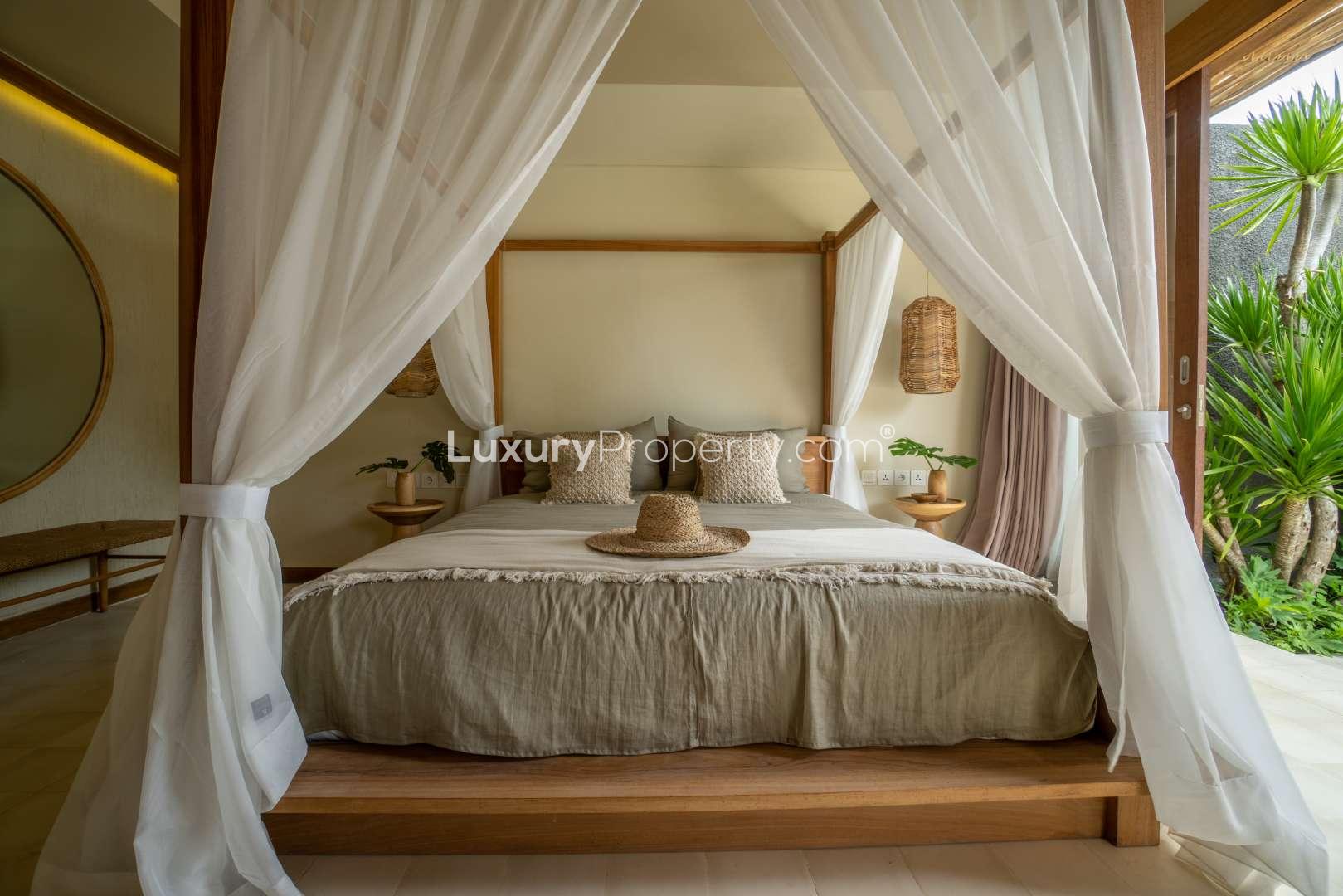 Luxurious bedroom in one-bedroom villa at Cocana Resort, Lombok with pool view