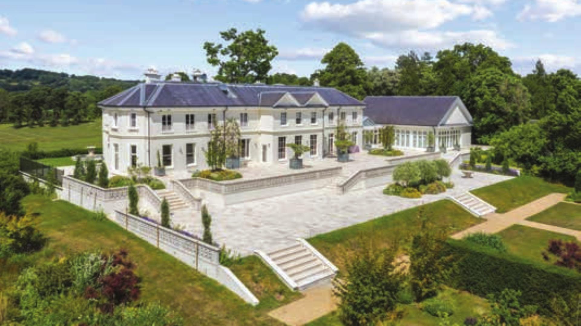 Aerial view of expansive Grade II listed estate with gardens near Sevenoaks, for sale