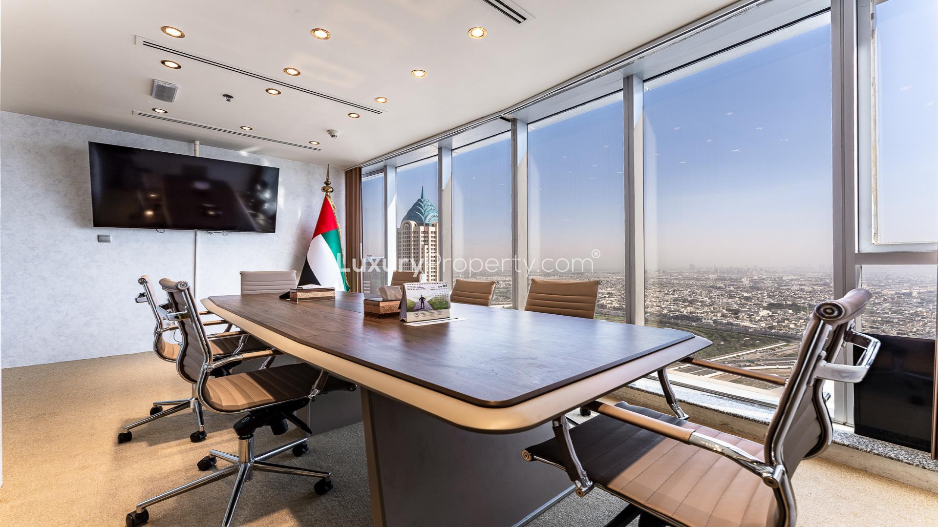 Modern office lobby in The Citadel Tower, Business Bay, with elegant decor and seating