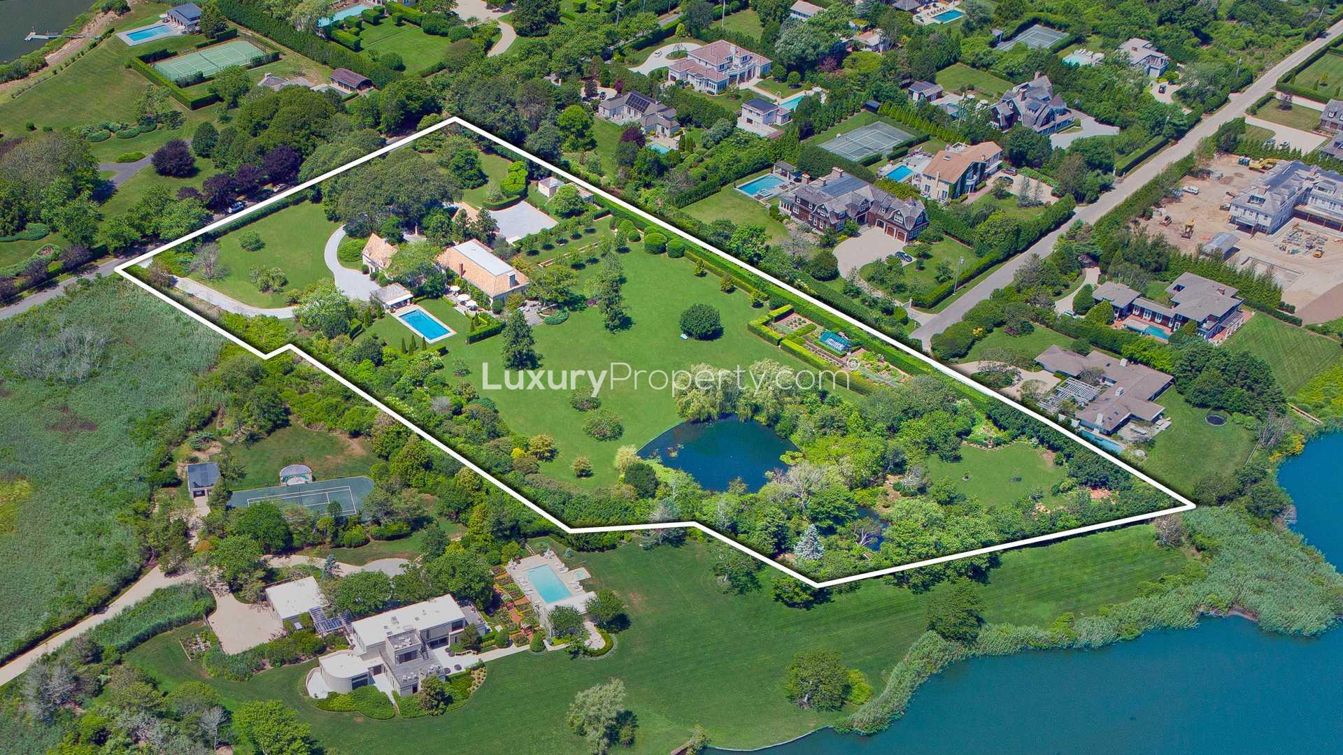 Aerial view of French-style villa with pool and gardens in Southampton, Hamptons, New York