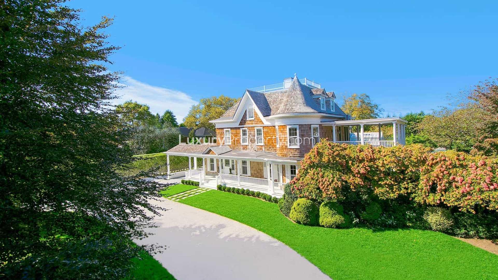 Luxurious bathroom in 19th-century Hamptons villa with claw-foot tub and elegant decor