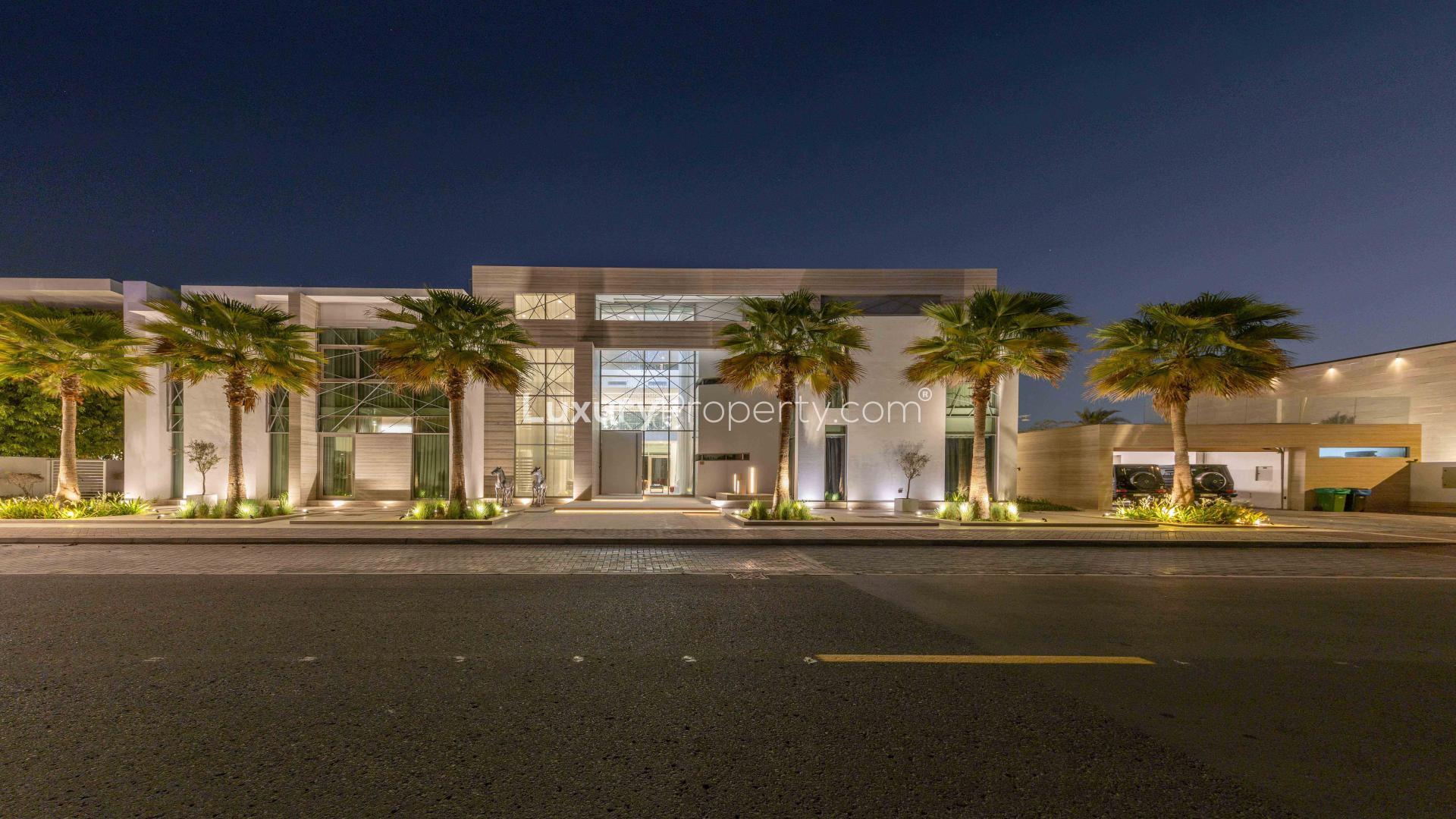Custom-built 10-bedroom mansion exterior at night, Palm Jumeirah, Signature Villas, for sale