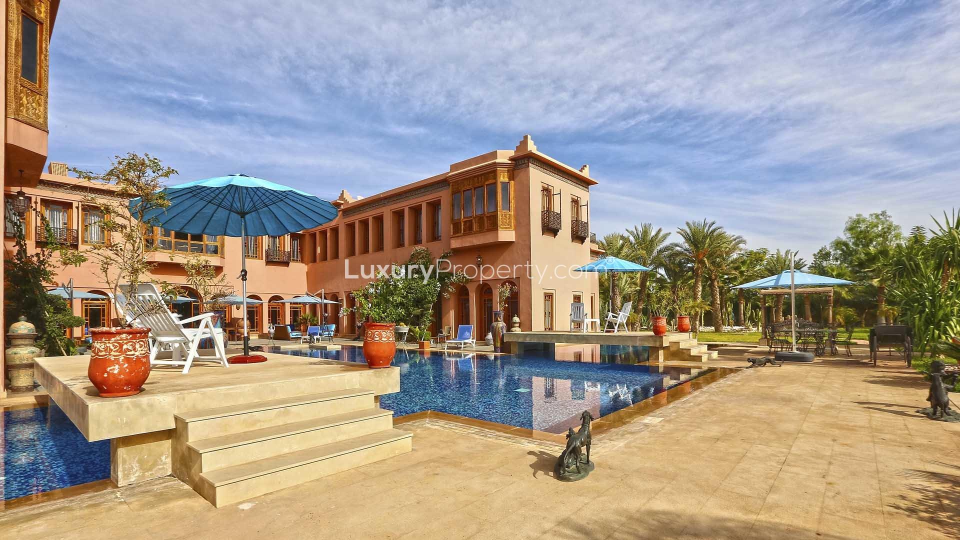 Luxurious villa in Palmeraie, Marrakech with elegant fountain and lush gardens for sale