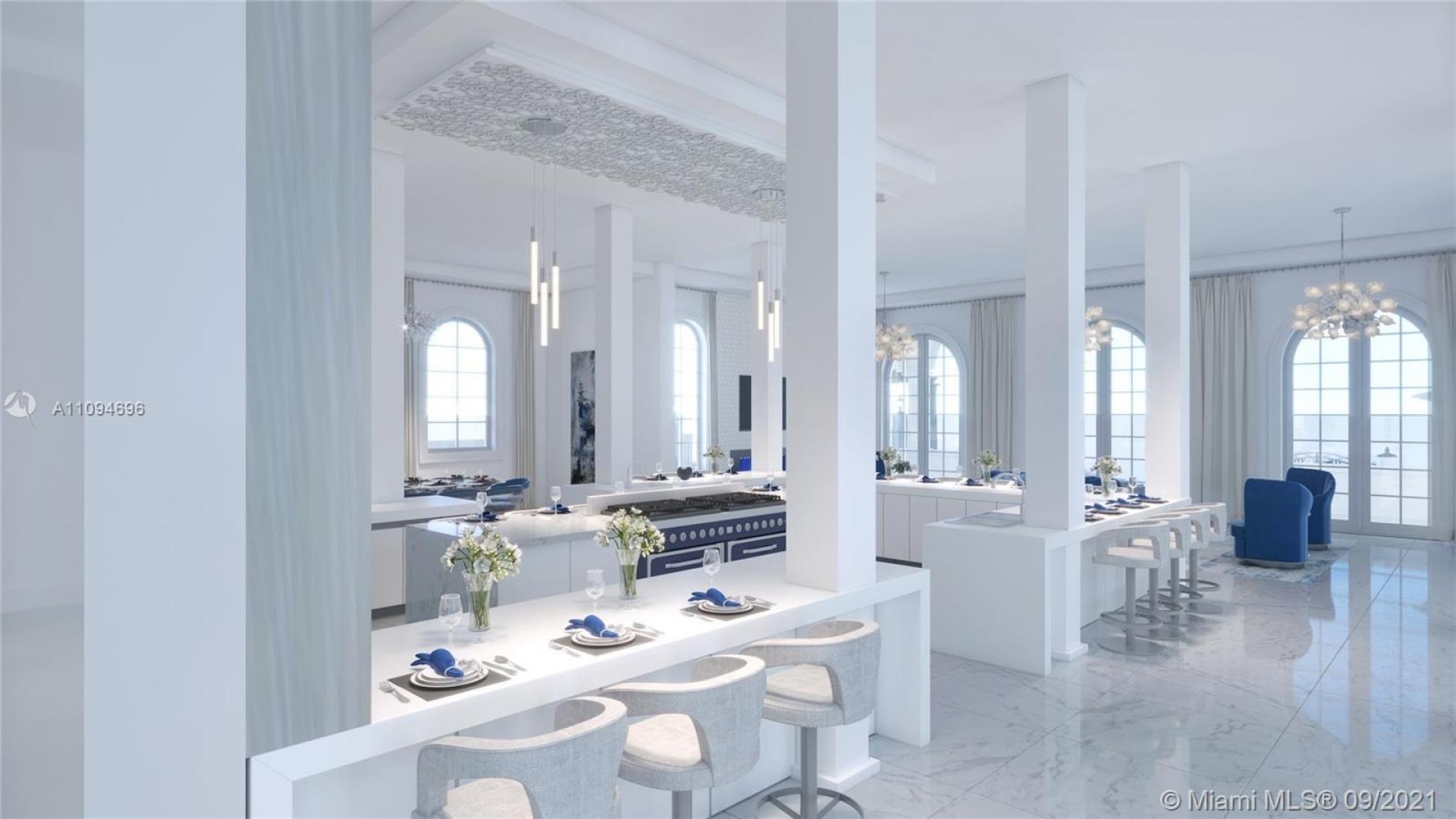 Luxurious open-plan kitchen and living area in Miami Beach mansion for sale