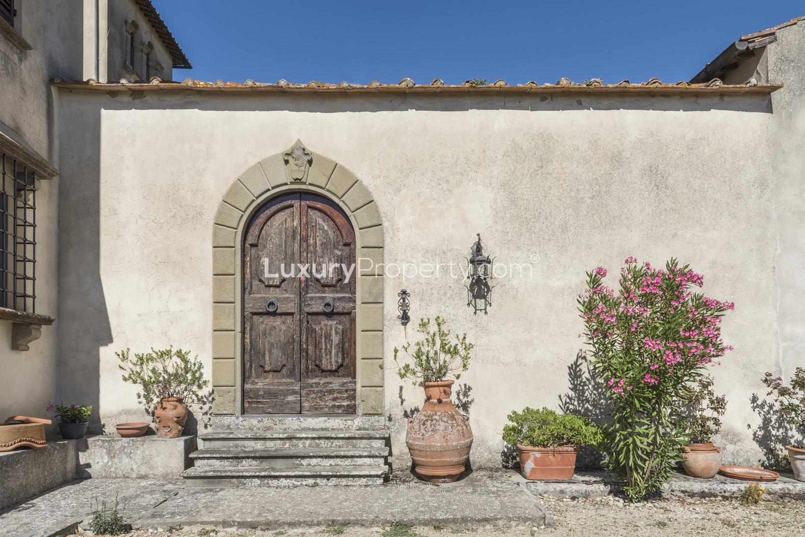Scenic view from 14th Century Villa Belvedere, Florence, with lush greenery and mountains