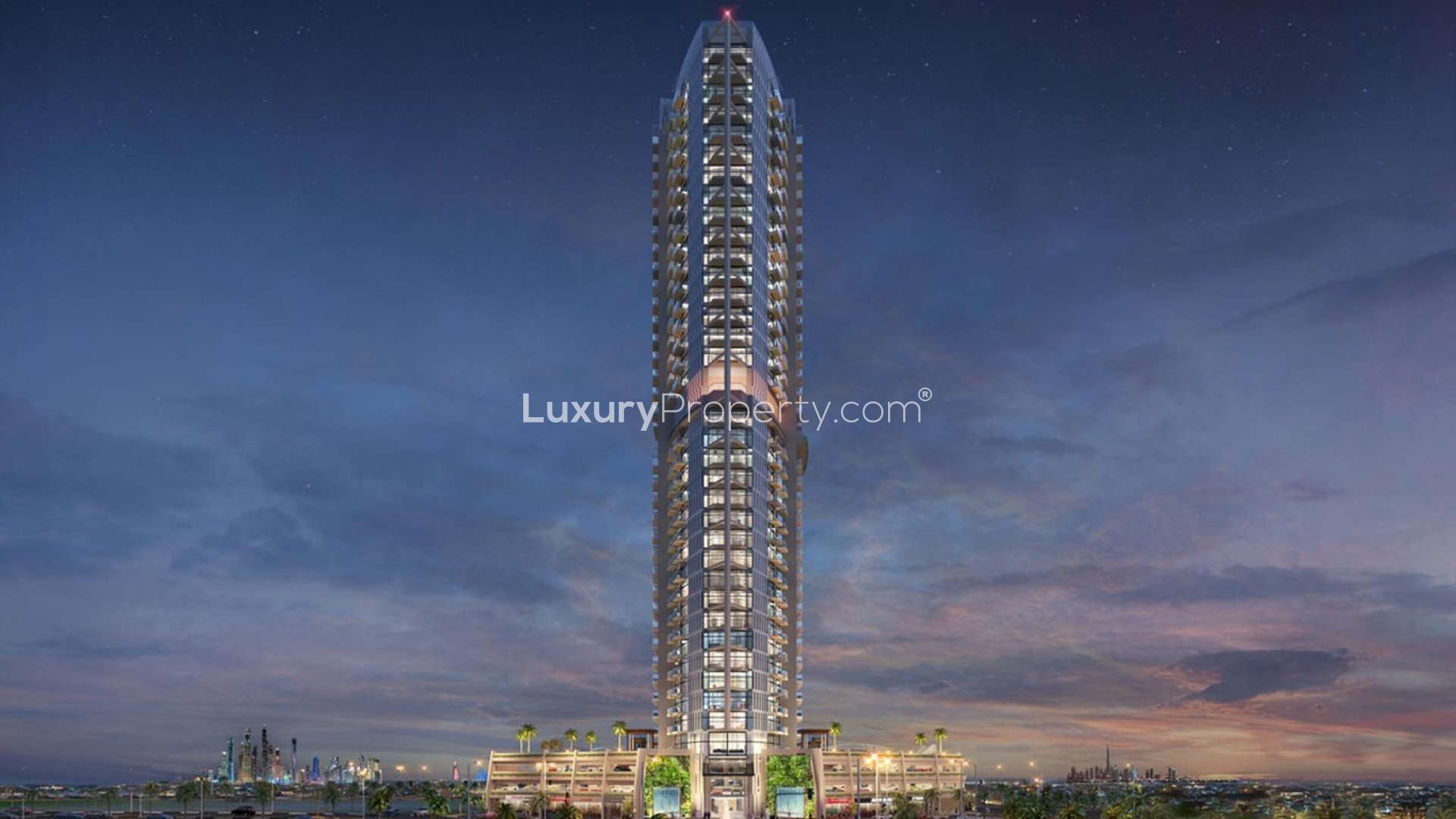 "Miraclz Tower by Danube, Arjan apartment for sale, night view with cityscape backdrop.",Miraclz Tower by Danube in Arjan, stunning residential high-rise for sale at sunset