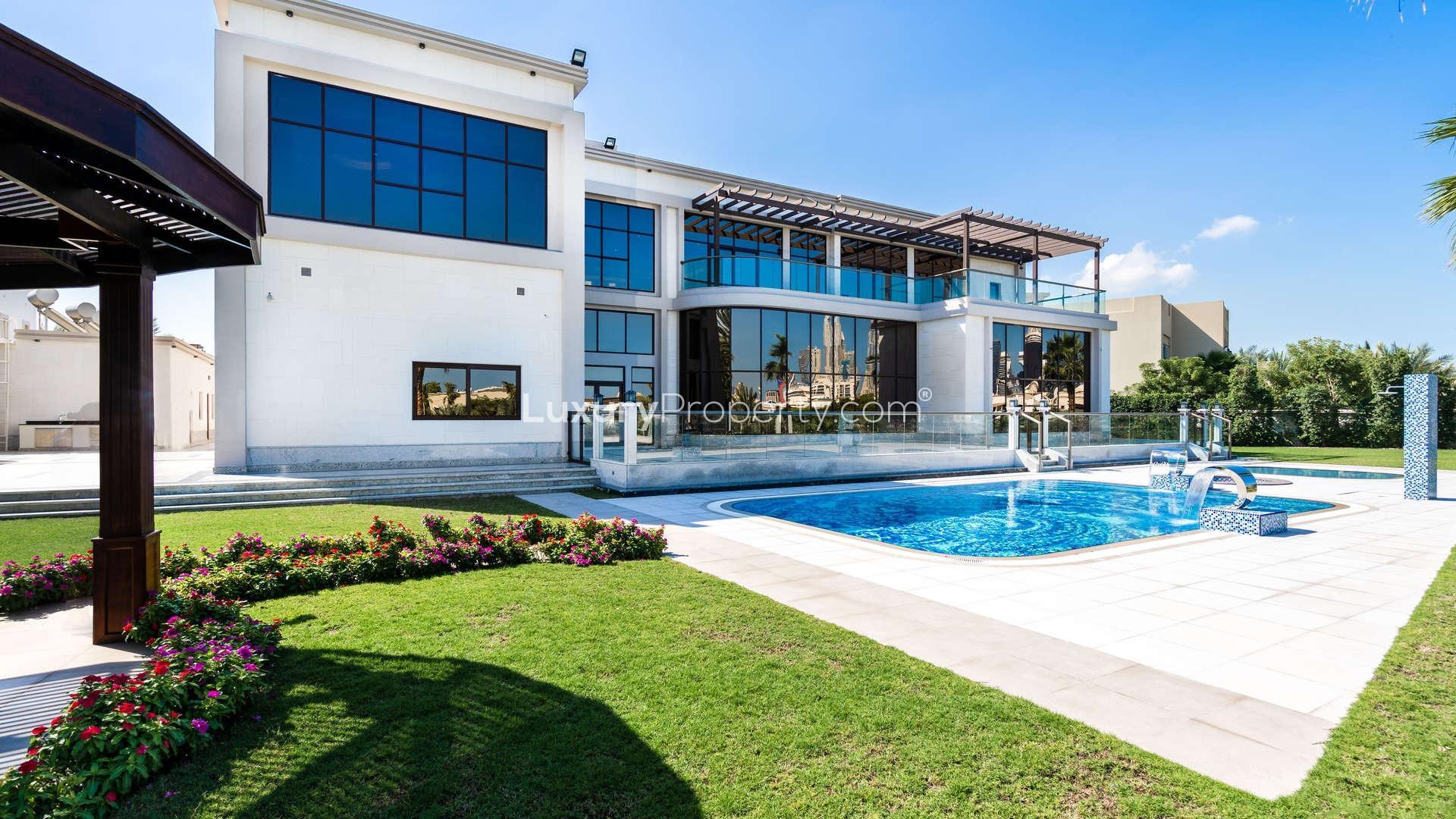 Spacious modern interior of luxury villa in Emirates Hills, Sector L, with large windows