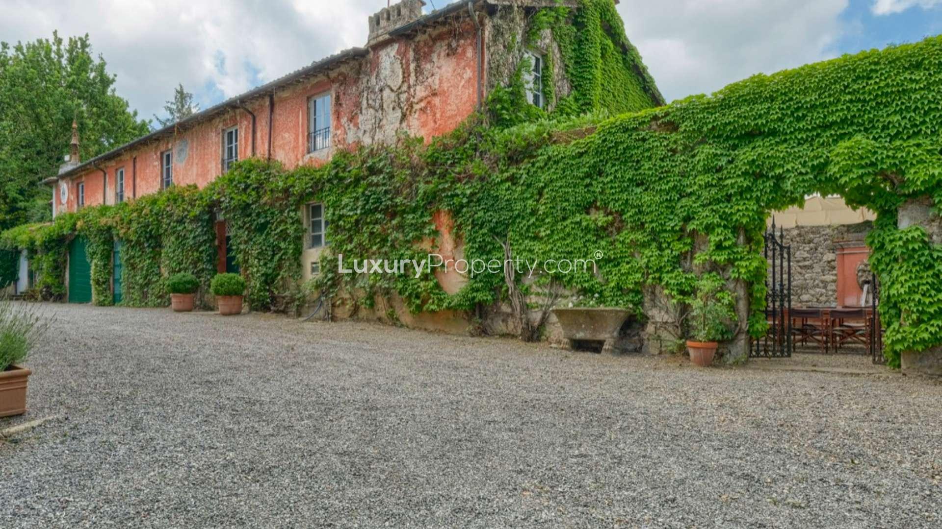 Elegant Lucca Aristocratic Manor Villa surrounded by lush greenery, available for sale
