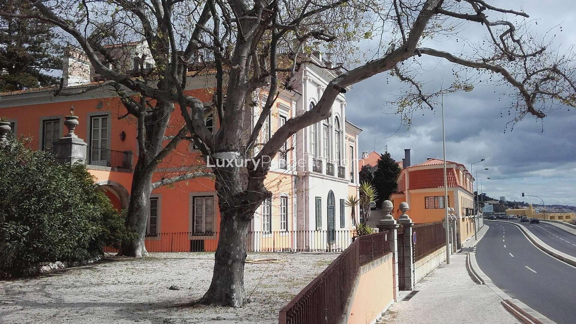 Neoclassical palace villa exterior with ocean view in Paço de Arcos, Portugal