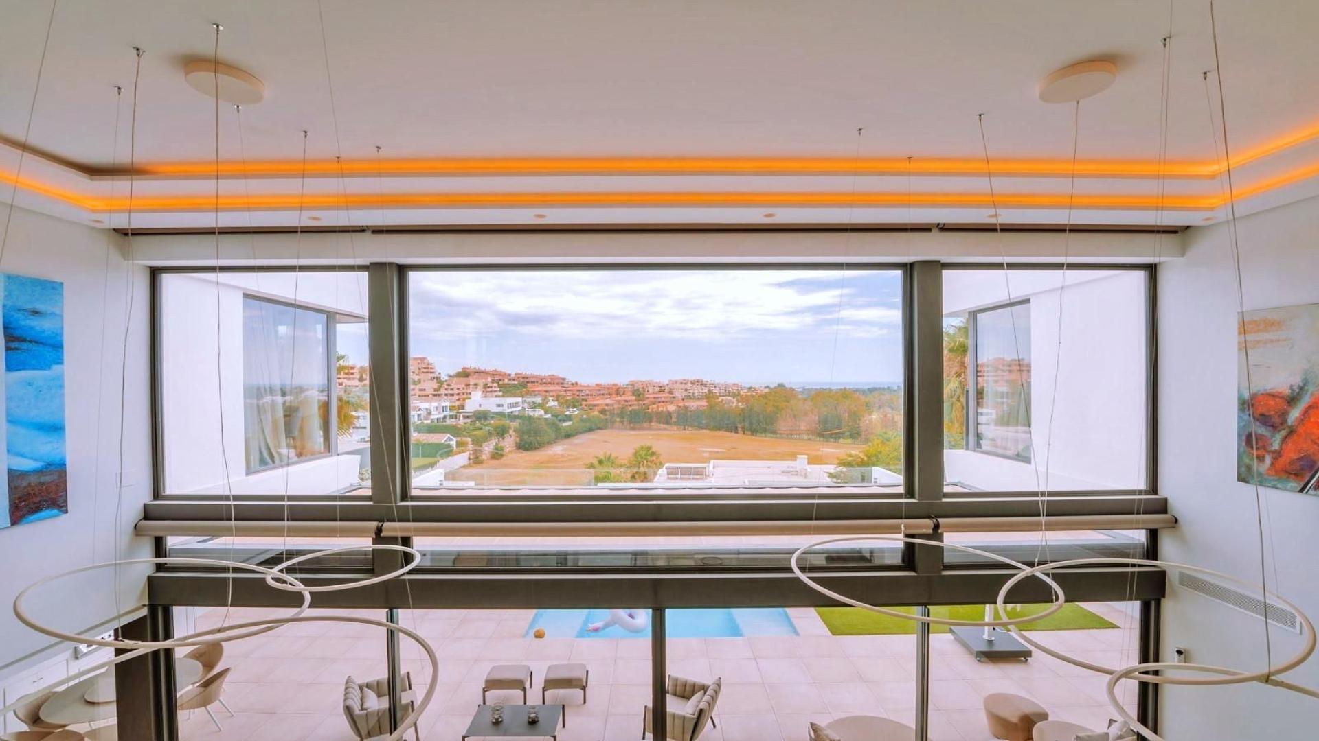 Luxury villa infinity pool with panoramic sea and golf views in Benahavís, Málaga