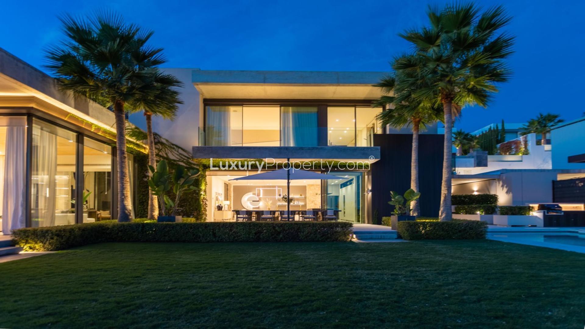 Luxurious Marbella villa with pool and sun loungers, scenic view of La Quinta community