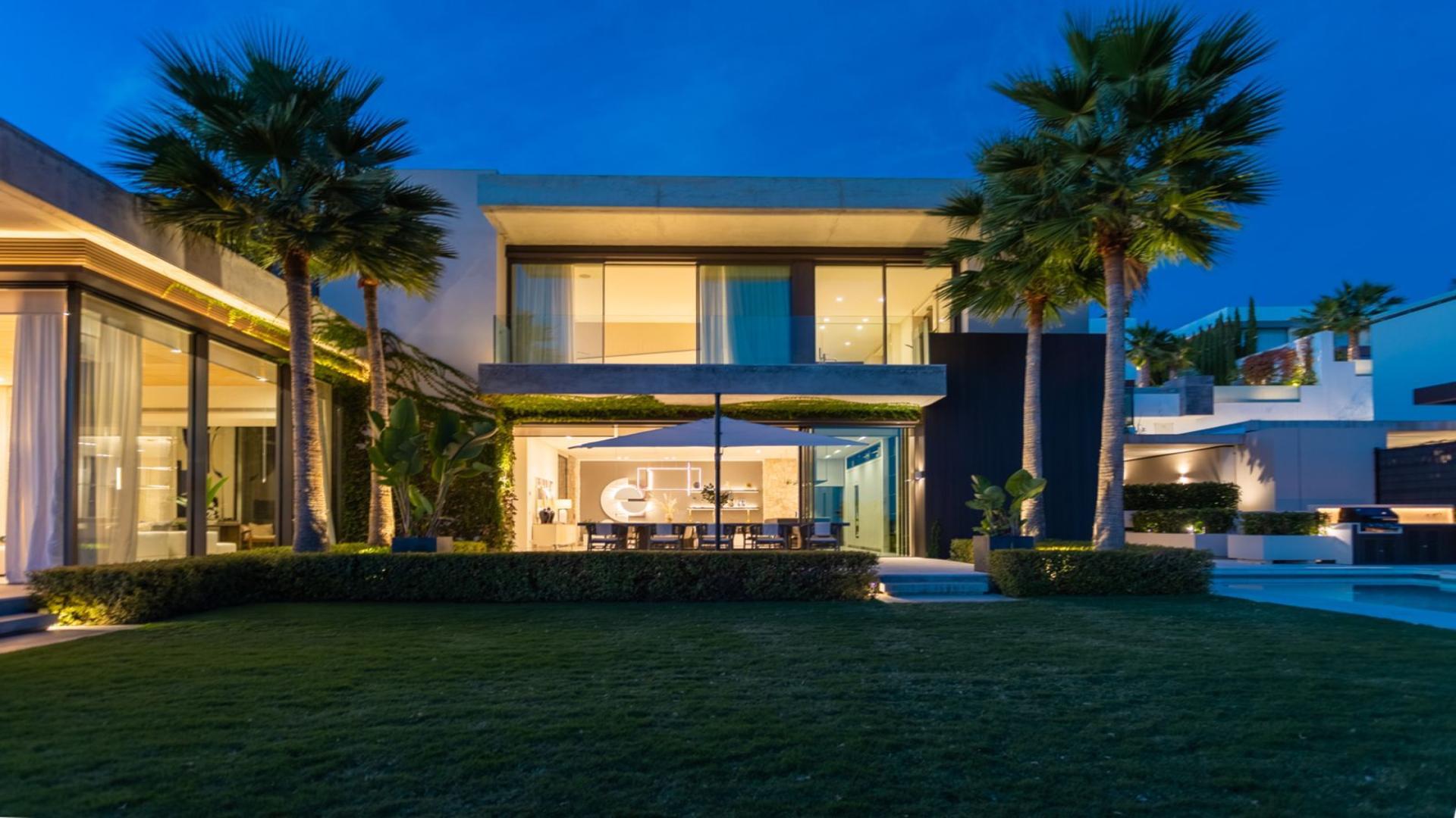 Luxurious Marbella villa with pool and sun loungers, scenic view of La Quinta community