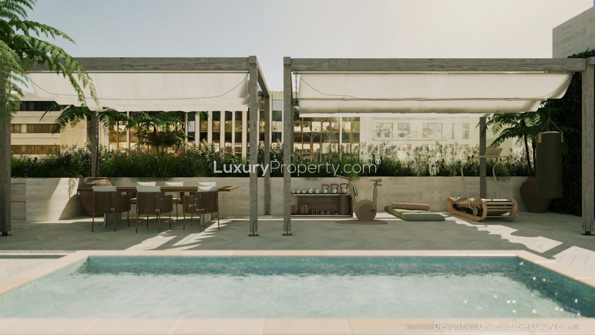 Luxurious open-plan living area in Lisbon penthouse with terrace and modern decor