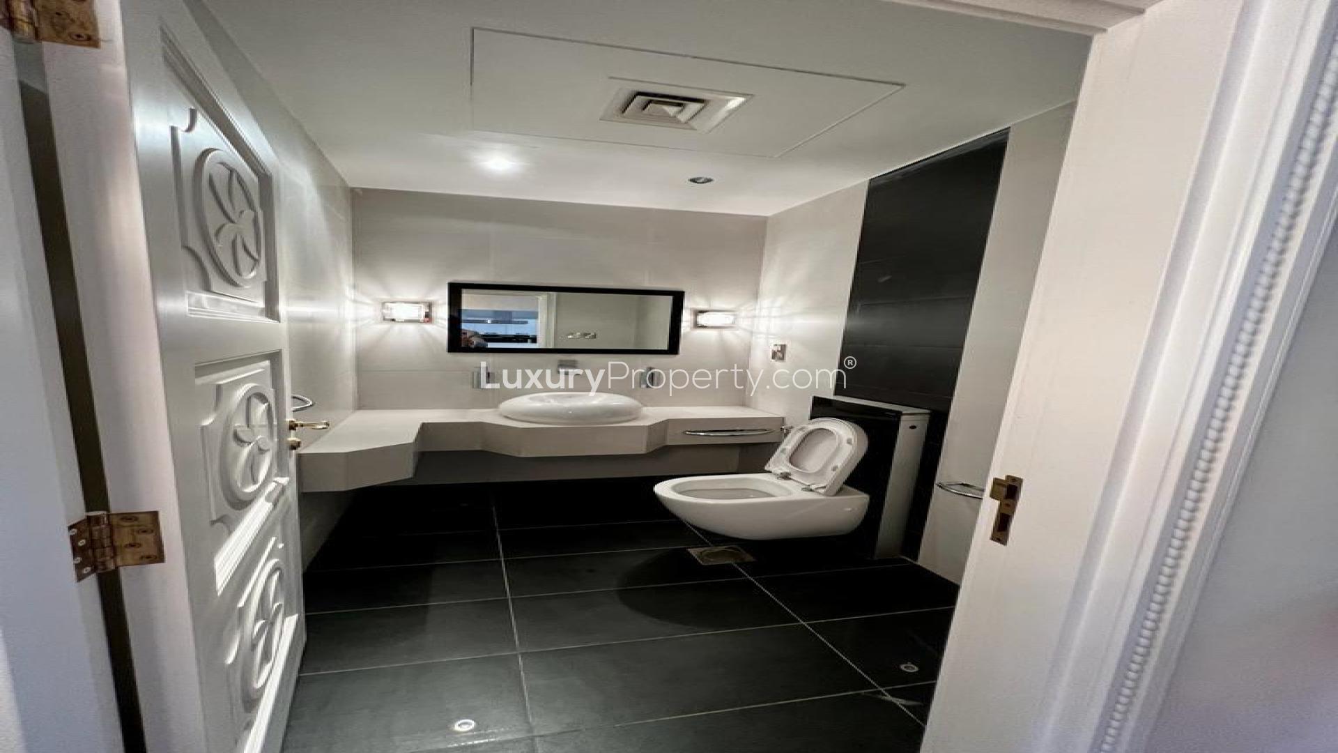 "Elegant villa hallway with red accents, hardwood floors, and stylish decor, LP46815 for sale.",Luxurious villa hallway with elegant decor, hardwood floors, and modern artwork