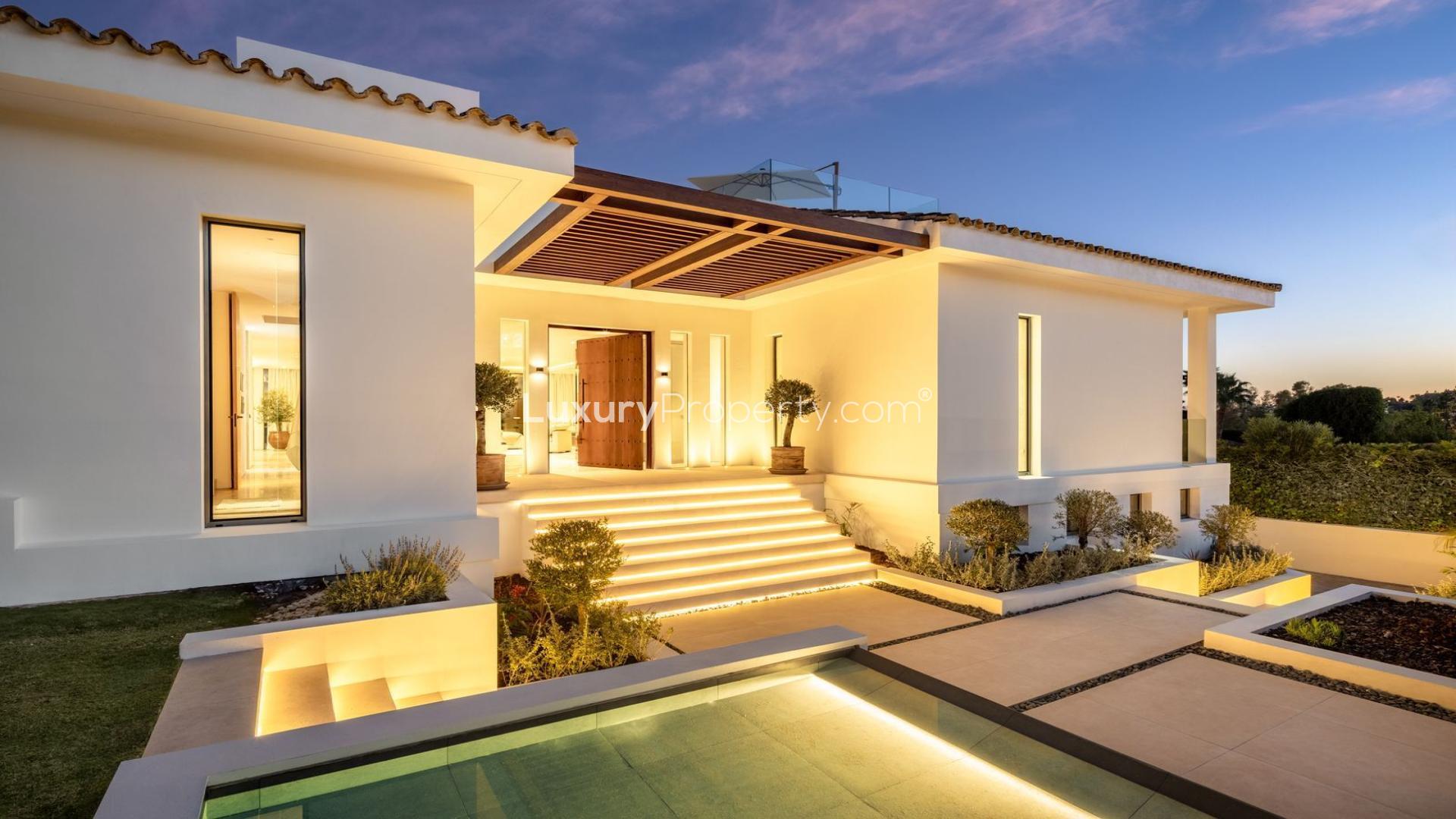 Luxurious Nueva Andalucía villa with pool and terrace at sunset, Málaga real estate