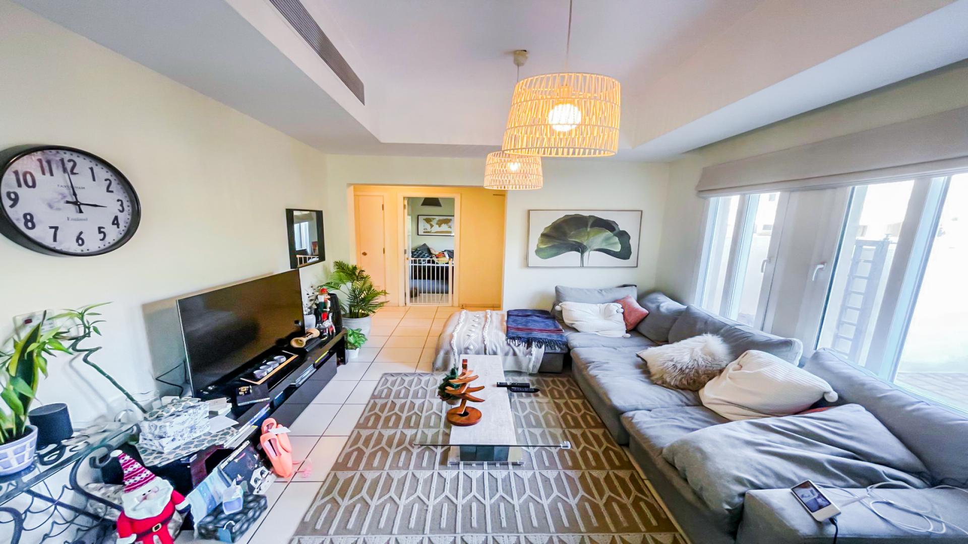 Bright living room in 2-bed villa, Maeen, The Lakes, with modern decor and garden views