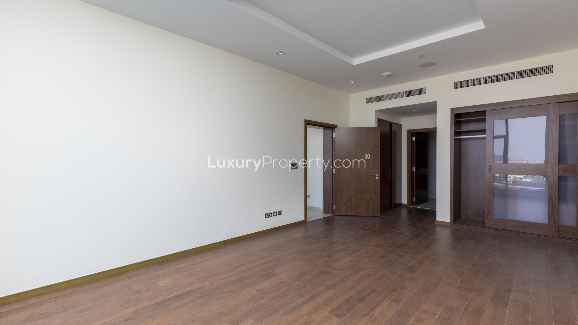 Modern kitchen in fully furnished Palm Jumeirah apartment, featuring sleek cabinetry and appliances