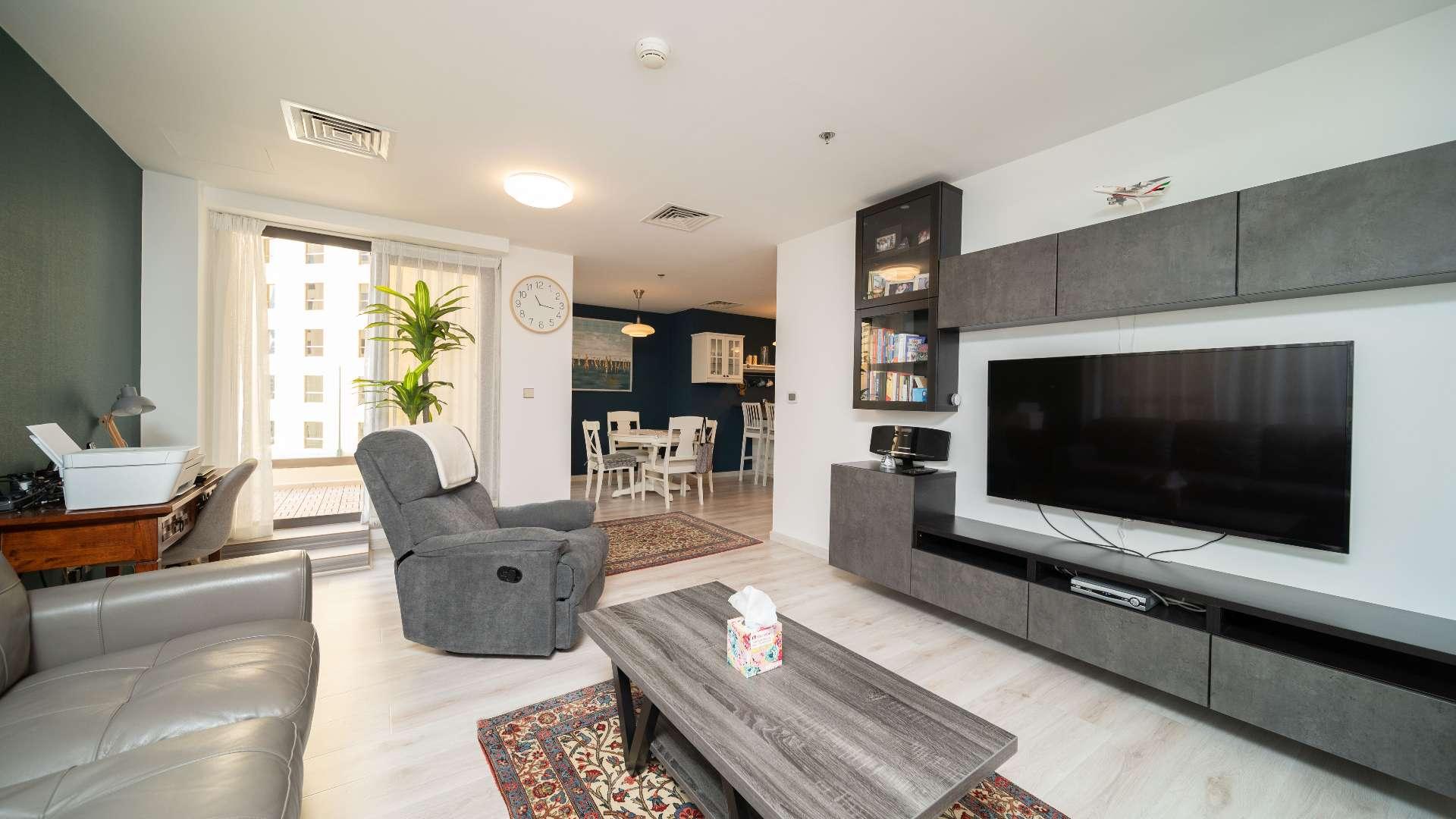 Furnished living room in upgraded Jumeirah Beach Residence apartment, Shams community, for sale