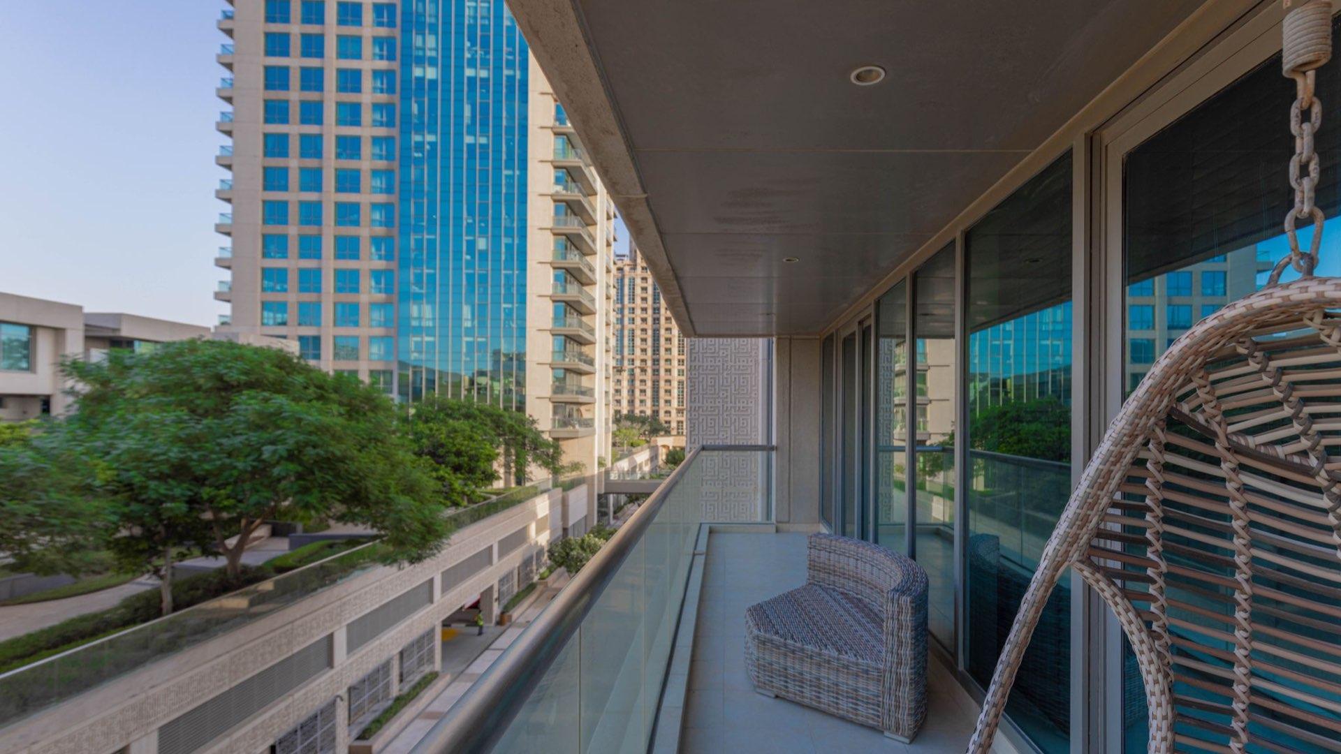 Spacious Fairways West apartment living room with large windows and modern decor