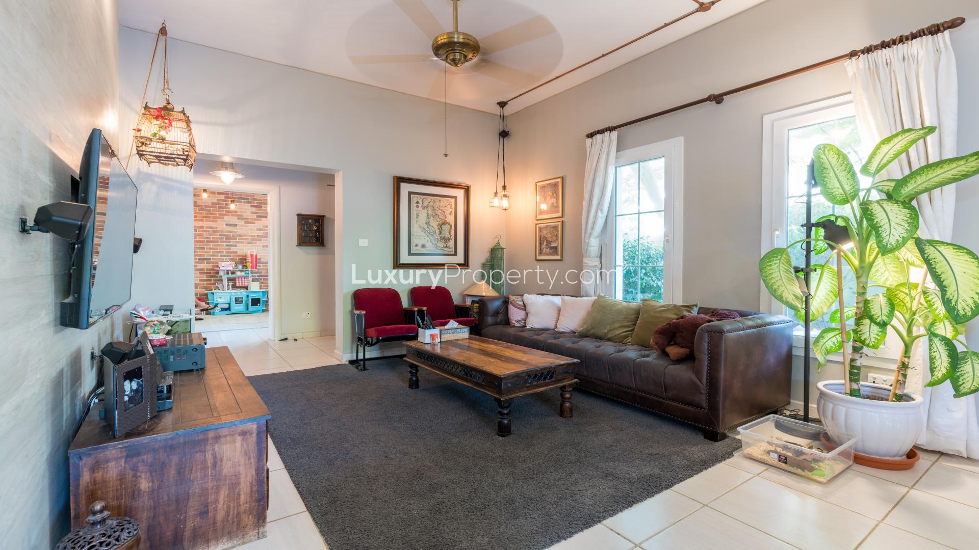 Living room in spacious villa, Springs 2, featuring cozy seating and large windows