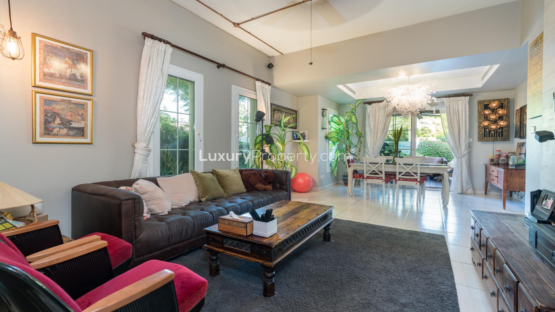 Spacious living room in Springs 2 villa, featuring elegant decor and garden view