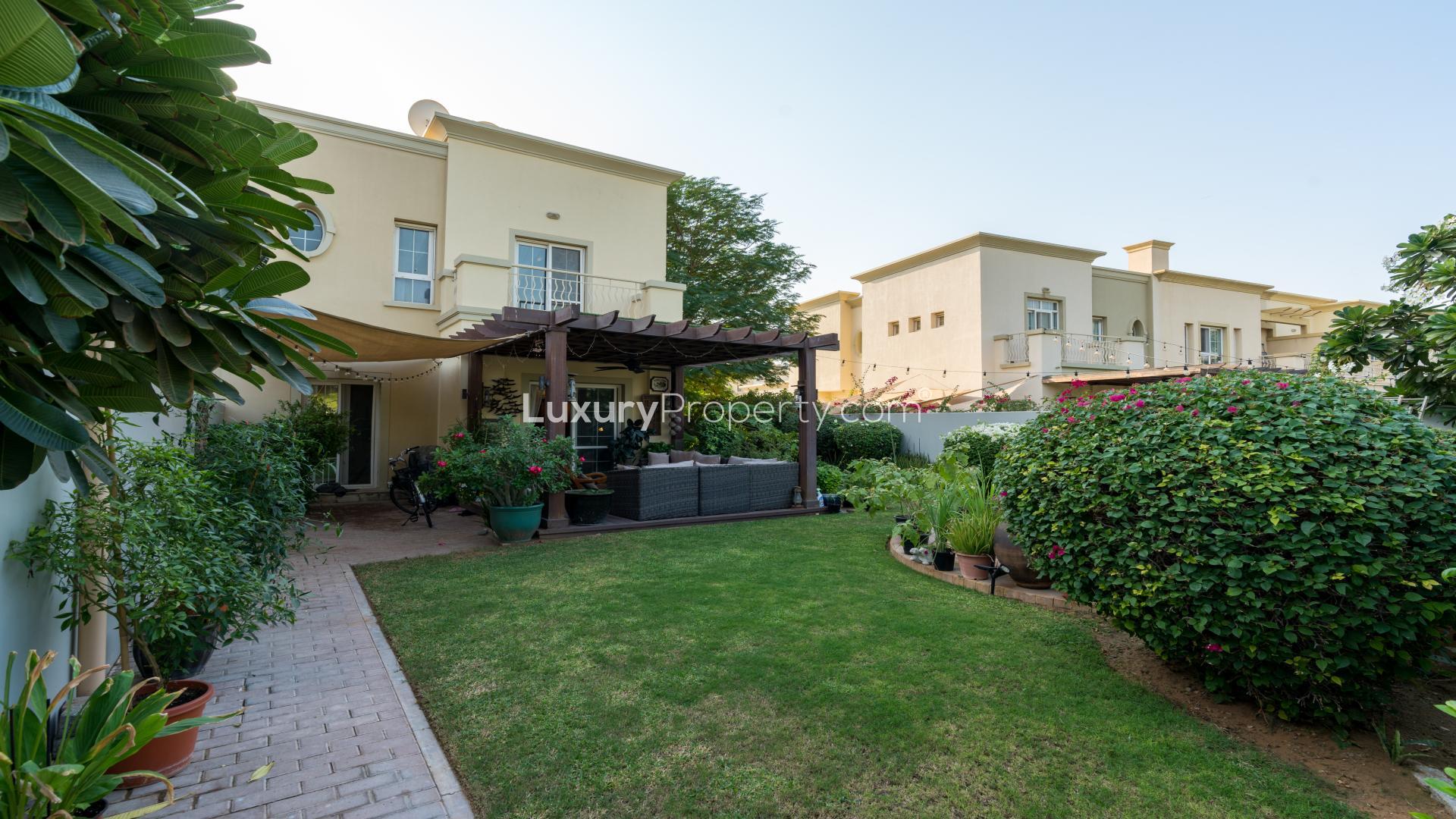 "Scenic view from villa in Springs 2 overlooking lush park and greenery, LP16122.",Large family villa with lush garden and patio in Springs 2, The Springs community