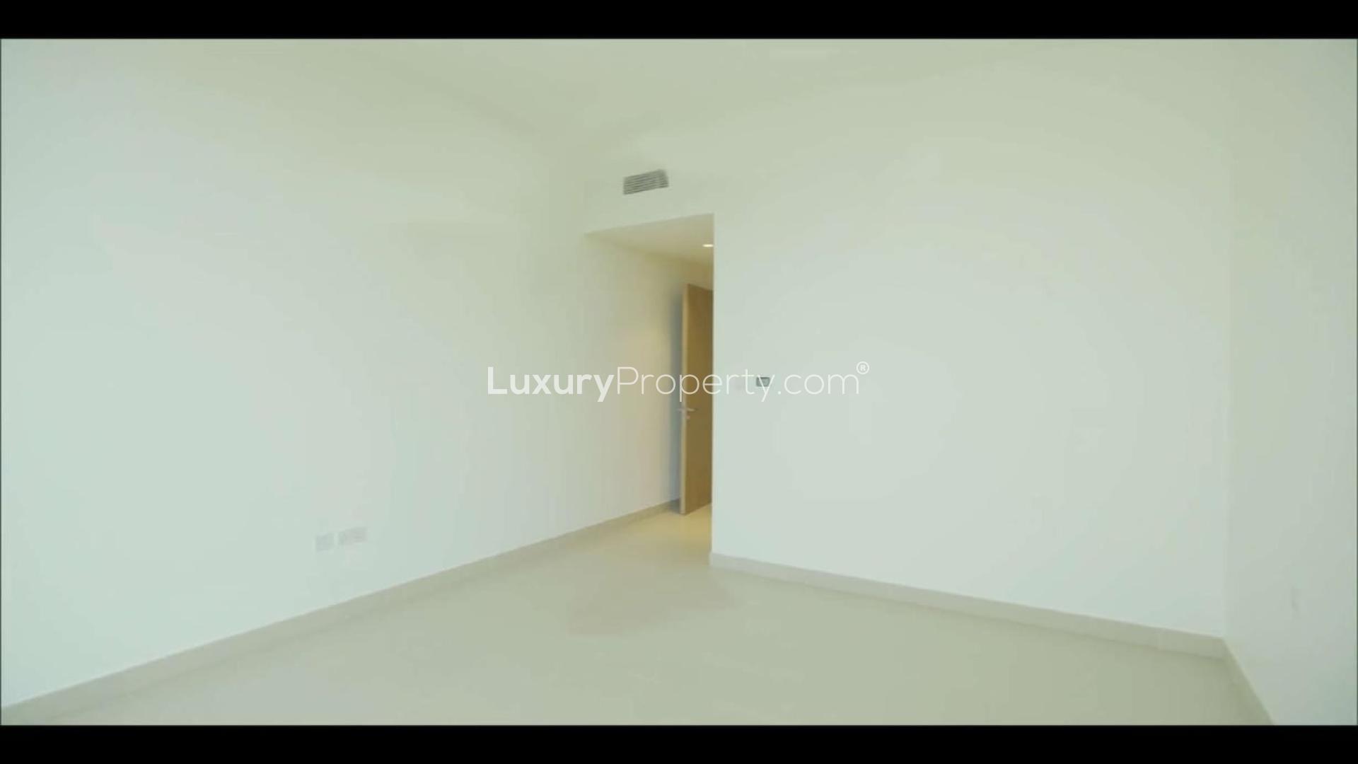 Lobby of Acacia Park Heights apartment, Dubai Hills Estate, featuring modern seating and decor