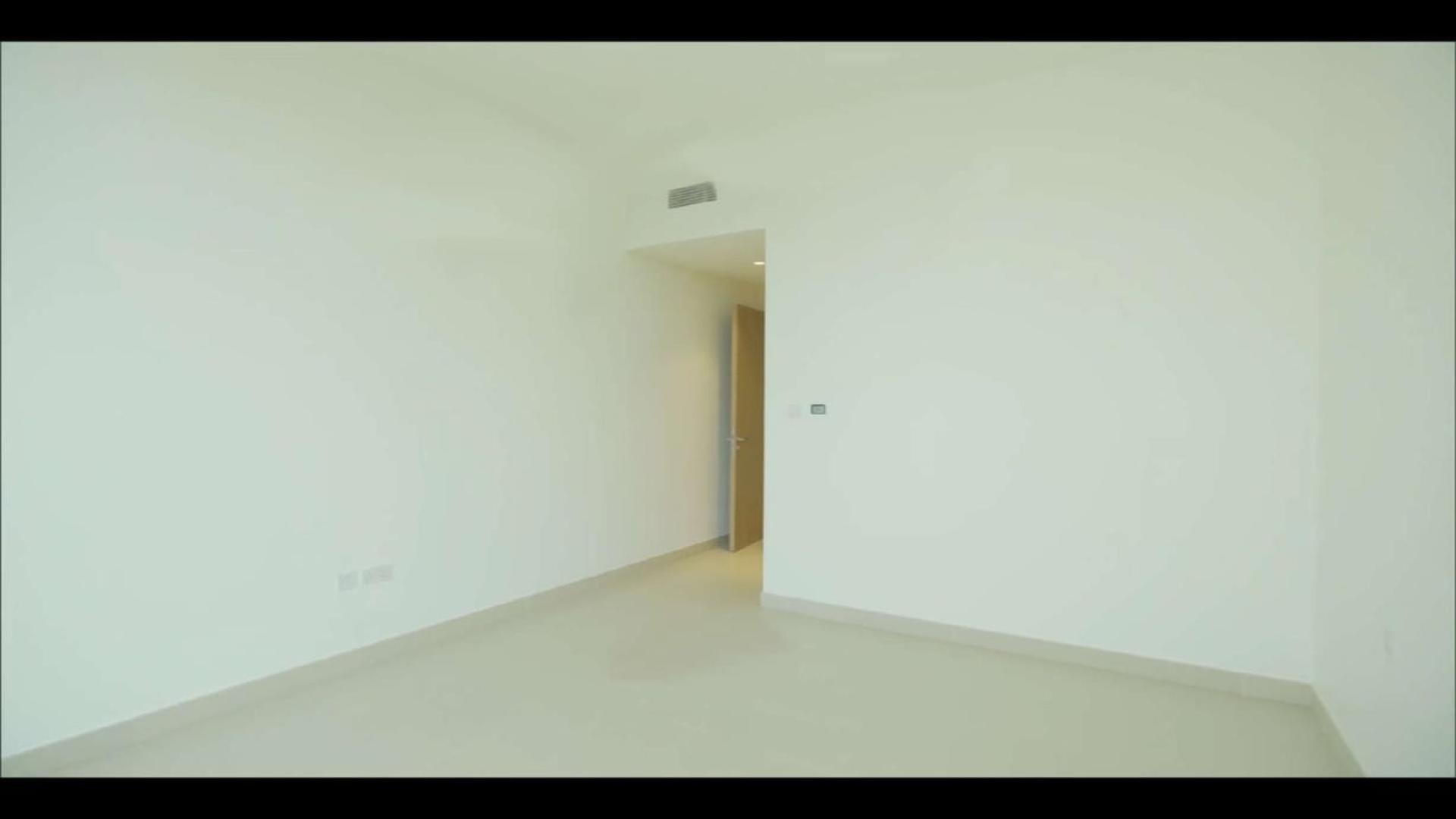 Lobby of Acacia Park Heights apartment, Dubai Hills Estate, featuring modern seating and decor