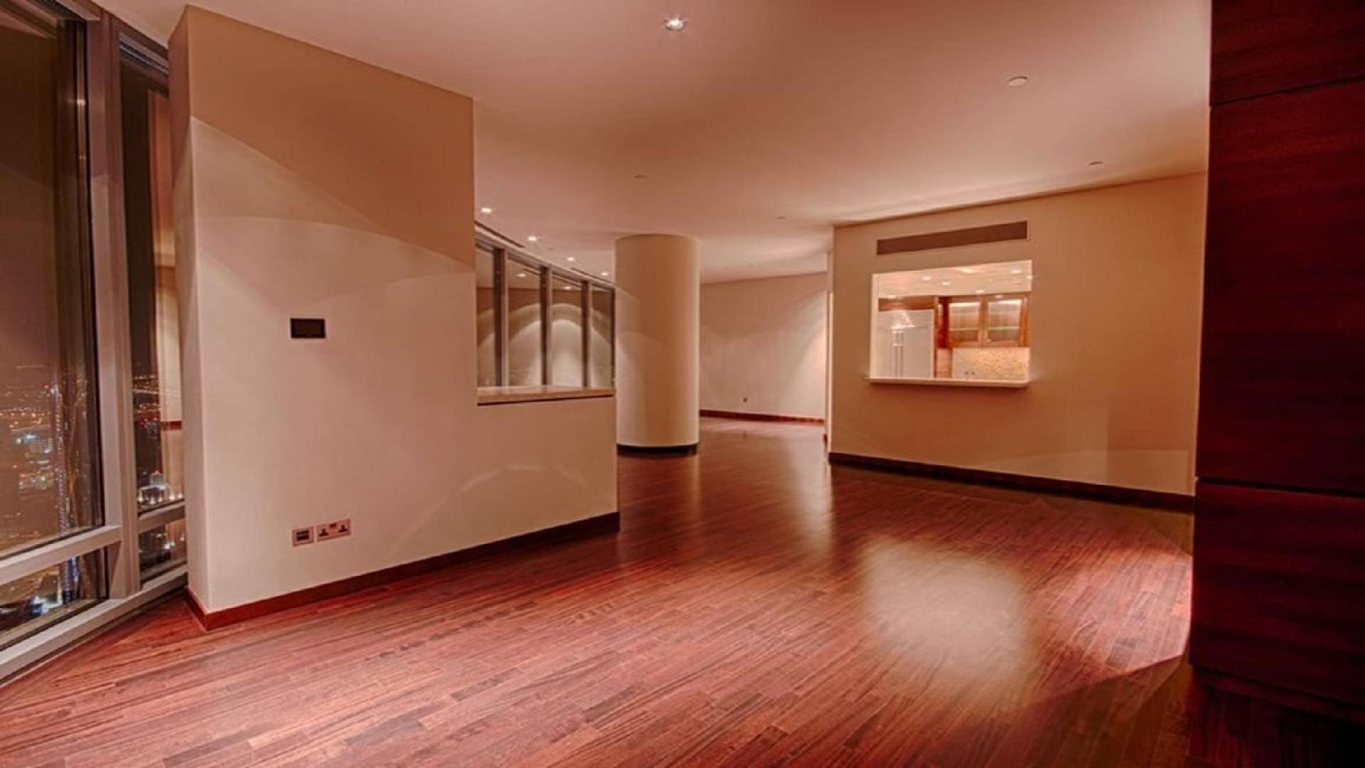 High-floor apartment interior with wooden floors and city view in Burj Khalifa, Downtown Dubai