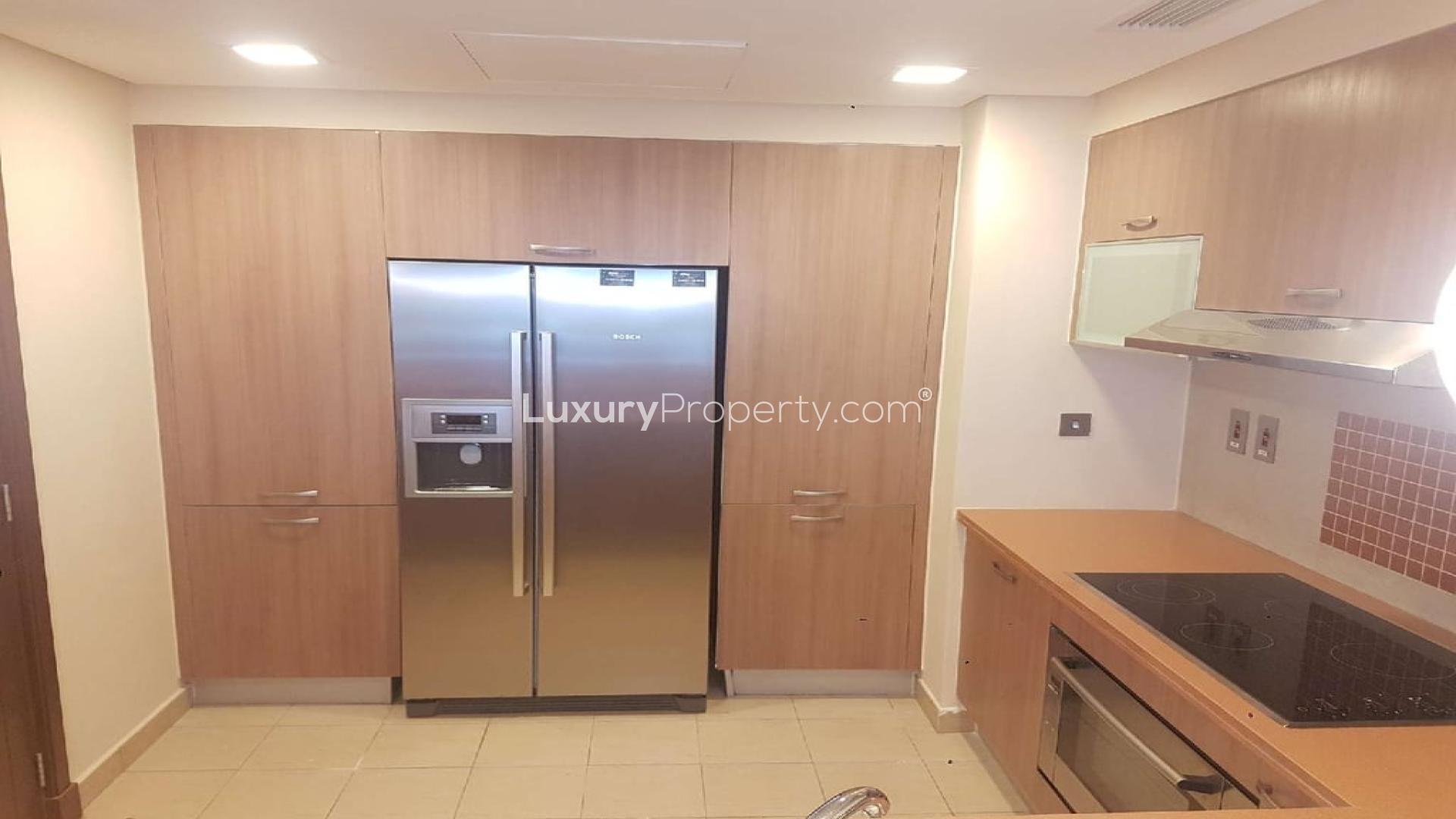 Modern living and dining area in Marina Residences apartment, Palm Jumeirah, with natural light