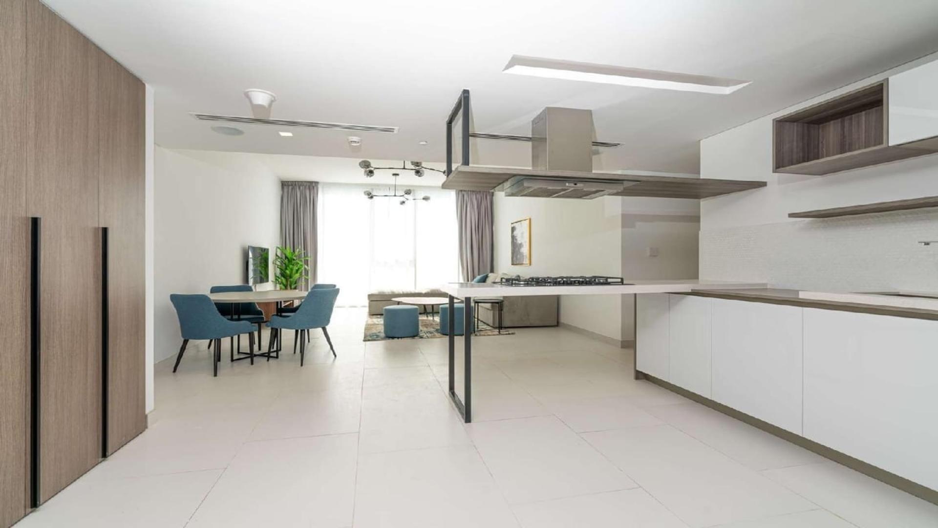 Modern kitchen and dining area in Soho Palm Jumeirah apartment for rent
