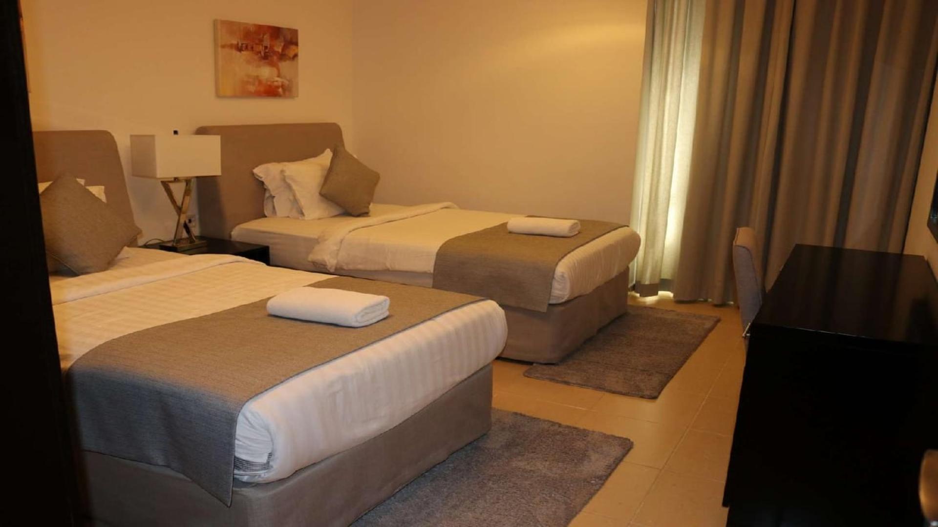 Furnished living room in 2-bedroom apartment, Shams 1, JBR, with modern decor and TV