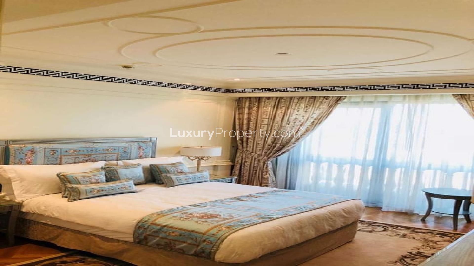 Aerial view of luxurious pool at Palazzo Versace Dubai apartment in Culture Village