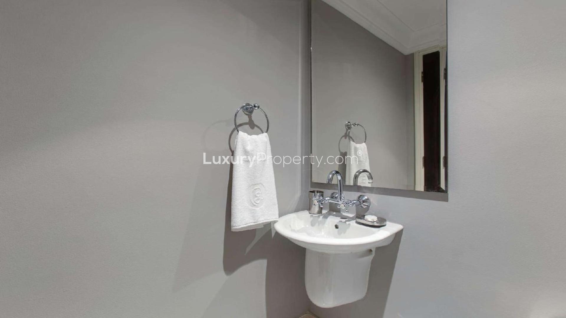 Stunning furnished living room in Old Town Island apartment with balcony view